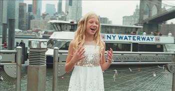 A talented teen vocalist sings ‘Stand in the Light’ in New York City, and there’s a reason his video is going viral.

The song was originally written and sung by the 9th season winner on The Voice, by Jordan Smith. He explained the deep meaning behind the song is about taking a risk to stand in the light of day and be truly seen for who we are. It’s so easy to wear masks, to cover up, to play the part, or pretend but we honor and glorify God when we choose to be who God created us to be. But someone else fell in love with the song too, teen vocalist, Lyza Bull. 

This is who I am inside
This is who I am, I'm not going to hide
'Cause the greatest risk we'll ever take is by far
To stand in the light and be seen as we are

Is it any wonder that Lyza Bull is taking the world by storm with her own version of Jordan’s song? With over 122,000 subscribers, she is quickly rising through the ranks of fame with her talent and love for Jesus. However, this song is going viral with over 318,000 views and counting! This video opens with Lyza singing perfectly, “Stand in the light and be seen for who we are.” The video is shot all throughout New York City and encompasses with the lyrics and meaning of this beautiful song. 

Lyza is a 13-year-old soprano and has even performed with the world renown One Voice Children’s Choir under the direction of Masa Fukuda. She has loved to sing since she could even talk. During the 2015 Christmas season, she was featured in Vocal Point’s “One Single Bell” video as a soloist, and in 2016, she participated in the TV special “Christmas Under the Stars.”

Go ahead, push play and be inspired to be who you are!

Dear friends, now we are children of God, and what we will be has not yet been made known. But we know that when Christ appears, we shall be like him, for we shall see him as he is. <a href="https://www.godtube.com/bible/1-john/3">1 John 3:2</a>
