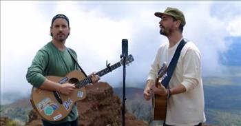Check out this chilling duet of two talented brothers singing the song ‘Tears In Heaven’ by Eric Clapton.
 
“Would you know my name? If I saw you in heaven
Would it be the same? If I saw you in heaven
I must be strong and carry on
‘Cause I know I don't belong here in heaven”
 
The two brothers in this music video are Clint and Bob, and they make up the group Music Travel Love. The pair is performing this song at the top of a mountain with incredible views behind them. It is just the two of them, their voices, two guitars, and one microphone. And the whole performance is just simple, serene, and peaceful.
 
The brothers’ voices blend so well together as they sing ‘Tears In Heaven,’ and it is beautiful to see the surrounding landscape around them as you listen to the song. The video shows scenes from above them as well as fluffy clouds that are capping off the mountain top that they are standing on.
 
Clint and Bob are from Canada and have been performing since the early age of 4 years old. Over the course of their career, they have sold over six million records, recorded 7 albums, and have Gold and Platinum records in 32 countries.
 
In 2015, the brothers released a single called ‘Goodbye Baby’ on The Highway Sirius XM that charted in the top 20. And in 2018, the duo started Music Travel Love and began their journey traveling around the world setting up their studio to create music outdoors. They share their music adventures on their YouTube, Instagram, and Facebook pages.
 
We hope that you enjoyed listening to this calming rendition of ‘Tears In Heaven’ by the group Music Travel Love. May you have a peaceful and blessed day!
