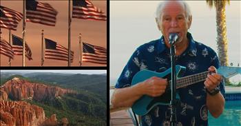 Jimmy Buffet embraces every part of the U.S.A. as he performs a unique rendition of “This Land is Your Land.” 

Over the years, Jimmy Buffet and his Coral Reefer Band have recorded 67 singles. Many of those songs transport listeners to sandy, southern ports, and the vibe of this performance is consistent with Jimmy’s other music. 

Jimmy stands barefoot in front of the microphone, wearing shorts and a nautical-themed shirt as he sings and plays the ukulele. Group members, in the background, are similarly dressed as they play steel pan drums and a melodica. They play poolside in a tropical setting. However, the images we see are from all across the United States, and we can truly feel the artist’s appreciation for all things American.     

Though there’s no way to know how many states are pictured throughout the video, there is a thorough representation of the beautiful and varied wonders this country has to offer. As the song goes, we see wheat fields, deserts and redwood forests. The Golden Gate Bridge, The Gateway Arch, and the Statue of Liberty are all featured, as well. And kids...lots of kids!

We see images of children and teens as they swing, ride bikes, dance on boardwalks, play baseball and scamper on the beach. It’s hard to feel anything but grateful for the opportunity to live in a country where kids can do all those things freely and where the landscape is so vast and breathtaking! 

Parades and sparklers, military servicemen and flags send a message of patriotism too. And, it’s clear that there’s at least one thing all Americans have in common—we can claim those snow-covered mountains, rolling rivers and picturesque New England falls as uniquely ours. This land is our land, from Jimmy’s own gulf stream waters to all the rest! Aren’t we blessed?

“Sing to the Lord with grateful praise; make music to our God on the harp.” <a href="https://www.godtube.com/bible/psalms/147-7">Psalms 147:7</a>

