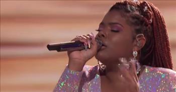 Gymani, a contestant on The Voice, gives an inspiring performance of the song ‘Made A Way’ by Travis Greene.
 
“Standing here not knowing how we'll get through this test
But holding onto faith you know best, nothing can catch you by surprise
You've got this figured out and you're watching us now
But when it looks as if we can't win, You wrap us in your arm and step in
And everything we need you supply, You got this in control, and now we know that”
 
This great song reminds us that nothing is impossible with God. He can move mountains, and He can perform miracles. Written by gospel singer and songwriter Travis Greene, the song ‘Made A Way’ shares a beautiful message that inspires others when they are going through difficult times. God is always there and always near. He will make a way.
 
In the Top 13 Live Playoffs on The Voice, Gymani performs ‘Made A Way,’ and her rendition showcases her beautiful and bright voice. Some of the judges are standing and swaying along to the song, and it is powerful to see her singing a gospel song on stage. She is sharing a moment of worship with the audience, and that is something that you don’t always see on television!
 
“An absolute spirit filled voice,” <a href="https://www.youtube.com/watch?v=GARYo-BhkbY">comments</a>  one person on YouTube after watching the video.
 
“A vocalist. A worshipper. Unashamed of God. May His favor be upon you, Gymani. Beautiful,” <a href="https://www.youtube.com/watch?v=GARYo-BhkbY">writes</a> another person online.
 
We hope that you enjoyed Gymani’s version of ‘Made A Way’ and it was able to encourage you today!
 
<a href="https://www.godtube.com/bible/matthew/6">Matthew 6:31-32</a> 
Therefore do not be anxious, saying, ‘What shall we eat?’ or ‘What shall we drink?’ or ‘What shall we wear?’ For the Gentiles seek after all these things, and your heavenly Father knows that you need them all.