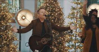 Listen to this great Christmas song called ‘Emmanuel God With Us’ by Chris Tomlin.
 
“Emmanuel, God with us, Emmanuel, King Jesus
The Savior of the world is born, Emmanuel, God with us
Emmanuel, King Jesus, the Savior of the world is born”
 
What a beautiful song that is a great reminder of the powerful king that we have the honor of serving.  In the music video, Chris Tomlin is singing his new Christmas song with a large chorus around him joining him in praise.
 
They are all so full of joy as they sing out the lyrics while surrounded by Christmas trees covered in lights. The music video was filmed in Nashville, and the song is part of Chris Tomlin’s new Christmas album.
 
“This song is all about the earth-shattering announcement of Emmanuel … the birth of our savior … God with us,” Chris Tomlin <a href="https://www.wnypapers.com/news/article/current/2021/11/04/148482/chris-tomlin-delivers-amazon-original-version-of-emmanuel-god-with-us-featuring-anne-wilson">shared</a>. 
 
Many people online shared their rave reviews of ‘Emmanuel God With Us.’
 
“This song is beautiful. It reveals the meaning of Christmas in a very impressive way,” <a href="https://www.youtube.com/watch?v=mt_xfOutfSQ">comments</a> one person on YouTube after watching the music video.
 
“With my eyes closed and hands lifted up, I can't get enough of this,” <a href="https://www.youtube.com/watch?v=mt_xfOutfSQ">writes</a> another person online. “God bless you Chris, it's gloriously done.”
 
There is such beauty in the Christmas story. And when we think about how Jesus came to earth as a humble baby to save us all, we can’t help but be thankful for such a glorious gift!
 
We hope that you enjoyed listening to ‘Emmanuel God With Us’ by Chris Tomlin today, and we hope that you experience the peace and joy that only Jesus can bring you this Christmas season!
 
<a href="https://www.godtube.com/bible/1-timothy/3-16">1 Timothy 3:16</a> 
Great indeed, we confess, is the mystery of godliness: He was manifested in the flesh, vindicated by the Spirit, seen by angels, proclaimed among the nations, believed on in the world, taken up in glory.
