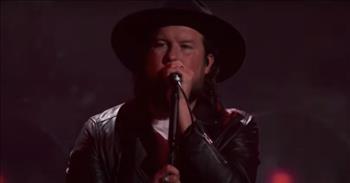 <p>Listen to this live performance of the song &lsquo;Stand Up&rsquo; by Zach Williams.</p>

<p>&ldquo;Are you lost and wanna be found, are there shackles on your feet that weigh you down<br />
Are you scared there's no way out, are you sick and tired of falling on the ground<br />
Stand up if you believe in the God of freedom, somebody give Him praise<br />
Stand up if you believe in the name of Jesus, somebody give Him praise&rdquo;&nbsp;</p>

<p>Zach Williams performed this powerful song live at the 2021 Dove Awards, and everyone in the audience was praising along with him. And many people online shared how much they loved the song as well.</p>

<p>&ldquo;You sing the real gospel. With the right voice and tremble,&rdquo; one person <a href="https://www.youtube.com/watch?v=uNyJEhdDy1M">comments</a> on YouTube after watching the video. &ldquo;God blessed you so much, and us, who can listen to your songs. Thank God and thank you.&rdquo;</p>

<p>&ldquo;Great song!&rdquo; another person <a href="https://www.youtube.com/watch?v=uNyJEhdDy1M">writes</a> online. &ldquo;I love your music! It's relatable and affirming. It touches everyone who hears it! Thank God you are out there making this music!&rdquo;</p>

<p>Zach Williams is a husband, father, and musician who lives in Nashville, Tennessee. According to his <a href="https://www.zachwilliamsmusic.com/">website</a>, he has &ldquo;become one of CCM&rsquo;s leading artists and songwriters by carving a niche with his singular blend of southern rock, country, and faith-filled songwriting, which quickly awarded him his first Grammy Award with his debut album, 2017&rsquo;s Chain Breaker.&rdquo;</p>

<p>When talking about his new album titled Rescue Story, Zach <a href="https://www.zachwilliamsmusic.com/">reflects</a> on all the blessings that God has given him. &ldquo;When I gave my life to the Lord, I realized He never left me, even in the dark times. For this new album, the title fits because every song in it has a rescue story. When you&rsquo;re at your end of the rope, that&rsquo;s when your rescue story begins. In my case, Jesus has been my rescue story.&rdquo;</p>

<p>We hope that you enjoyed listening to Zach William&rsquo;s song &lsquo;Stand Up&rsquo; today!</p>
