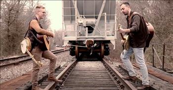 <p>Enjoy the musical stylings of Southern Raised Bluegrass as they perform a toe-tapping rendition of &lsquo;Dueling Banjos.&rsquo;</p>

<p>&lsquo;Dueling Banjos&rsquo; is a popular bluegrass song penned by Arthur &quot;Guitar Boogie&quot; Smith. Composed in 1954, it took nearly 20 years for the iconic tune to truly take off. After &lsquo;Dueling Banjos&rsquo; was featured in the 1971 movie, &lsquo;Deliverance&rsquo; it shot to the top of the charts. Decades later, it still remains a favorite song for covers and performances.</p>

<p>Today, Southern Raised Bluegrass is putting their own spin on this iconic tune.&nbsp;</p>

<p>Siblings Lindsay, Emily and Matt plus their friend Alex, make up the Southern Raised Bluegrass band. The group was raised in the Ozark Mountains and they have blended their traditional music upbringing with multiple genres and their deep-rooted faith. For years, they&rsquo;ve entertained us with popular covers of songs such as &lsquo;What A Day That Will Be&rsquo; and &lsquo;Shenandoah.&rsquo;</p>

<p>The group <a href="https://www.youtube.com/watch?v=l5vLsPjI928">describes</a> themselves as creating a &lsquo;Southern Raised trademark sound where classical meets bluegrass and city streets meets country roads. SR has morphed a progressive sound that spans Christian Country/ Bluegrass, Celtic and Classical.&rsquo;</p>

<p>Just listen as the two gentlemen of the group stand on opposite sides of a train track with banjos in their head. Then, they begin to play and it&rsquo;s truly a performance that you don&rsquo;t want to miss.&nbsp;</p>

<p>From beginning to end, this iconic song is given new life by this bluegrass band.</p>

<p>The jury is still out but who do you think won this banjo duel?</p>
