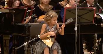 <p>Such a young girl has so much talent. In this video, a 7-year-old goes viral with a mesmerizing Balalaika performance.&nbsp;</p>

<p>At the cue of the conductor, a precious little girl begins to play impressively. Anastasia Tyurina plays a Russian folk song, &quot;Valenki.&quot; She not only hits the notes correctly, but she strategically finesses the strings with personality and poise.&nbsp;</p>

<p>A balalaika is a stringed wooden instrument from Russia. The balalaika is in the lute family. This unique sound is very cheerful and fluid. It creates the sound of dance.&nbsp;</p>

<p>As you watch this young girl, prepare to be amazed at her far above-average skill set. Anastasia is a complete prodigy. She plays with excellence and personality. At the end of the song, the orchestra finishes strong.&nbsp;</p>

<p>The conductor helps guide the girl to the front so she can take a bow as the audience cheers. She bows and smiles so big, proud of her performance. This is one brave young one.&nbsp;</p>

<p>Watching the skills of Anastasia reminds us of the amazing talents that God gave to King David. David was also a gifted musician who played the harp. David used his skills to glorify the Lord. God is our Creator and He made music.&nbsp;</p>

<p>Anyone who witnesses or participates in the making of music is reminded of the complexity and beauty of our great God. It is truly amazing to hear such a God-given musical gift. It is intriguing because based on this girl&rsquo;s age, she should not be able to play at such a high level, but our Lord is the Giver of all gifts for His glory.</p>

<p><em>&ldquo;Whenever the spirit from God came on Saul, David would take up his lyre and play. Then relief would come to Saul; he would feel better, and the evil spirit would leave him.&rdquo; <a href="https://www.godtube.com/bible/1-Samuel/16-23">1 Samuel 16:23</a></em></p>
