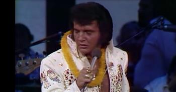 <p>Check out this great performance by Elvis Presley singing &lsquo;Blue Suede Shoes&rsquo; in Hawaii.</p>

<p>&ldquo;Well, it's one for the money, two for the show, three to get ready, now go, cat, go<br />
But don't you step on my blue suede shoes, well you can do anything<br />
But stay off of my blue suede shoes, well, you can knock me down<br />
Step in my face, slander my name all over the place, well do anything that you want to do<br />
But uh-uh, honey lay off of them shoes, and don't you step on my blue suede shoes&rdquo;</p>

<p>This performance by Elvis Presley was filmed in Honolulu, Hawaii on January 14, 1973. It was part of his Aloha From Hawaii concert, and it made television and entertainment history. It was beamed live via Globecam Satellite to various countries, on a delayed basis to approximately thirty European countries, and it first aired in America that April 4th on NBC in edited form.</p>

<p>In total, the Aloha From Hawaii concert was seen in over forty countries by close to 1.5 billion people, a global ratings smash. This had never happened before where one performer held the world&rsquo;s attention in such a way.</p>

<p>Many say that the Aloha From Hawaii was one of the most outstanding concert performances of Elvis&rsquo;s career.&nbsp;&nbsp;</p>

<p>The song &lsquo;Blue Suede Shoes&rsquo; was written by Carl Perkins, and it has left a deep impression on popular culture. In fact, it was the first proper rock and roll hit!</p>

<p>Elvis Presley was a friend of Carl Perkins and recorded the song himself, taking it to the American masses via TV appearances. &lsquo;Blue Suede Shoes&rsquo; also became the opening shot of his seminal debut album of 1956.</p>

<p>We hope that you enjoyed this throwback video of the King of Rock and Roll performing &lsquo;Blue Suede Shoes&rsquo; in Hawaii!</p>
