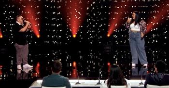 <p>Watch this duet performance of &lsquo;The Prayer&rsquo; earn a standing ovation from the judges on American Idol. Wow, these contestants can really sing!</p>

<p>&ldquo;I pray you'll be our eyes, and watch us where we go<br />
And help us to be wise, in times when we don't know<br />
Let this be our prayer when we lose our way, lead us to a place<br />
Guide us with your grace, to a place where we'll be safe&rdquo;</p>

<p>What an incredible performance! In this clip from the Hollywood Week Duets on American Idol, powerhouse singers Nicolina and Christian Guardino give a performance of 'The Prayer' that will leave you speechless.</p>

<p>They both sound amazing individually, and when they sing together, their harmonies are absolutely wonderful! They even got a standing ovation from the other singers in the audience as well as all three of the judges.</p>

<p>&ldquo;We&rsquo;re mesmerized at how you just play off of each other. It has all the makings of something so special,&rdquo; said Lionel Richie after the performance.</p>

<p>Then Lionel Richie went on to talk about how the Hollywood Week Duets play out. There is usually one person that ends up staying and one person that is sent home.</p>

<p>&ldquo;I can just make this very simple. When you have a duel, somebody gets shot. When you have voices of this power, it&rsquo;s cut throat,&rdquo; he said. &ldquo;I think it&rsquo;s quite obvious, you both cut through. You&rsquo;re both going to the next round.&rdquo;</p>

<p>Once both contestants realized that they both made it through to the next round, they cheer and embraced on stage, and the three judges also stood to their feet to give them a round of applause. What a beautiful moment!</p>

<p>With voices like that, we can&rsquo;t wait to see how far Nicolina and Christian will go in this competition!</p>
