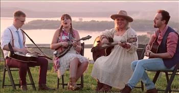 <p>Feel inspired as Southern Raised Bluegrass performs the iconic country tune, &lsquo;When You Say Nothing At All.&rsquo;&nbsp;</p>

<p>This classic song was originally written by Paul Overstreet and Don Schlitz. It became a number one hit for artist Keith Whitley in 1988 and, almost ten years later, Alison Krauss performed her own cover of the song with the group Union Station.&nbsp;</p>

<p>Over the years, &lsquo;When You Say Nothing At All&rsquo; has cemented itself as one of the greatest country love songs of all time.</p>

<p>&ldquo;It&#39;s amazing how you can speak right to my heart<br />
Without saying a word, you can light up the dark<br />
Try as I may, I can never explain<br />
What I hear when you don&#39;t say a thing&rdquo;</p>

<p>Today, we&rsquo;re hearing a very special rendition of this ballad.&nbsp;</p>

<p>Siblings Lindsay, Emily and Matt plus their friend Alex, make up the Southern Raised Bluegrass band. The group was raised in the Ozark Mountains and they have blended their traditional music upbringing with multiple genres and their deep-rooted faith. For years, they&rsquo;ve entertained us with popular covers of songs such as &lsquo;What A Day That Will Be&rsquo; and &lsquo;Shenandoah.&rsquo;</p>

<p>The group <a href="https://www.youtube.com/watch?v=Hlp7YSgymeA">describes</a> themselves as creating a &lsquo;Southern Raised trademark sound where classical meets bluegrass and city streets meets country roads. SR has morphed a progressive sound that spans Christian Country/ Bluegrass, Celtic and Classical.&rsquo;</p>

<p>Just listen as they come together to belt out the words of &lsquo;When You Say Nothing At All.&rsquo;&nbsp;</p>

<p>&ldquo;The smile on your face lets me know that you need me<br />
There&#39;s a truth in your eyes saying you&#39;ll never leave me<br />
The touch of your hand says you&#39;ll catch me wherever I fall<br />
You say it best, when you say nothing at all&rdquo;</p>

<p><em><a href="https://www.godtube.com/bible/1-corinthians/13-13">1 Corinthians 13:13</a> &ldquo;But now abideth faith, hope, love, these three; and the greatest of these is love.&rdquo;</em></p>
