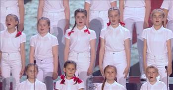 <p>In this sweet audition, we see a group of brave kids celebrate the sacrifices of their parents. A precious children&#39;s choir sings &#39;Stand Up&#39; in honor of their hero parents.</p>

<p>We see children in white and red adorably standing on the Britain&rsquo;s Got Talent stage. A little girl begins to sing in the sweetest voice. The entire choir starts singing together and it is adorable.&nbsp;</p>

<p>Their lyrics say that they are proud of what their parents do as they stand confidently with smiles on their faces. As they sing about standing together there are pictures of each individual choir member with his or her parents behind them on a slide show.</p>

<p>The ages range from kindergarten through middle school and each one is passionate and enjoying this opportunity. The chorus sings out and changes keys. They use arm motions and end their performance with excitement.&nbsp;</p>

<p>The audience cheers loudly. All four of the judges and the audience stand in ovation as children tear up on the stage and family members in the audience cheer them on. The judges rave about their performance being courageous and emotional. They tell them that they are proud of them.&nbsp;</p>

<p>These kids showed great bravery in their performance, but ultimately with their lives. It&nbsp; is a great sacrifice to have family members who serve in the military and these children live this every day. They are little heroes.&nbsp;</p>

<p>When we think about sacrifices that are made to protect freedom and safety in a nation, it reminds us that God sees us and cares for us. Jesus is our greatest Hero and He has already fought for us and won. We can celebrate Him and stand up for Him each and every day.</p>

<p><em>&ldquo;It is for freedom that Christ has set us free. Stand firm, then, and do not let yourselves be burdened again by a yoke of slavery.&rdquo; <a href="https://www.godtube.com/bible/Galatians/5-1">Galatians 5:1</a></em></p>
