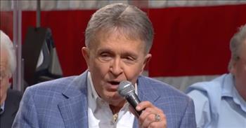 <p>Listen to the touching words of the song 'Old Army Hat (God Bless America Again),' a patriotic tune penned by Bill Anderson.</p>

<p>&ldquo;He came home to Tennessee, a young man at the end of &lsquo;45<br />
The only one of seven men in his platoon that made it back alive<br />
He must have seen some tough times, but he never talked to much about all that<br />
Put his pictures and his memories in a cedar chest, everything but his old Army hat&rdquo;</p>

<p>What a great song! The lyrics describe a man who wears his old Army hat to honor his friends that did not survive WWII. And how he takes an emotional visit to the WWII memorial in Washington, DC where he passes his Army hat down to a man who lost his father to the war.</p>

<p>Bill Anderson shared how the song came about and what inspired the lyrics to the song.</p>

<p>&ldquo;This song that I&rsquo;m about to share with you is a true story. I read about this man in a newspaper article in his hometown. He&rsquo;s from a little town called Millington, Tennessee down near Memphis. He just turned 90 years old, and he&rsquo;s a WWII veteran. And when I read his story I said, &lsquo;This is a song waiting to be written.&rsquo;&rdquo;</p>

<p>Bill continued: &ldquo;I got with a great writer from down in Alabama named Walt Aldridge. And Walt and I sat down with the newspaper article and some pictures that were provided by the family, and we tried to tell the story of this man. His name is Ed Haley, 90 years young. It&rsquo;s about Ed Haley and his old Army hat. I hope you&rsquo;ll listen to the words.&rdquo;</p>

<p>At the end of the song, Bill starts singing &lsquo;America the Beautiful,&rsquo; and the rest of the room joins in. What an emotional and patriotic tune!</p>
