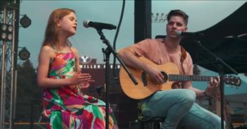 <p>Watch this wonderful video of 9-year-old viral sensation Claire Crosby singing the song &lsquo;Easy On Me&rsquo; by Adele with her dad.</p>

<p>&ldquo;There ain&#39;t no gold in this river hat I&#39;ve been washin&#39; my hands in forever<br />
I know there is hope in these waters but I can&#39;t bring myself to swim<br />
When I am drowning in this silence, baby, let me in, go easy on me, baby<br />
I was still a child, didn&#39;t get the chance to, feel the world around me<br />
I had no time to choose what I chose to do, so go easy on me&rdquo;</p>

<p>What a fantastic performance! Claire sings with such emotion and passion, and the young girl has such great control of her voice. As she is singing next to her dad while he plays on the guitar, one can&rsquo;t help but think about what a great bonding moment that must be for the two of them, making beautiful music together up on stage.</p>

<p>Claire Crosby started to sing at a very young age, and she became a YouTube sensation at just the age of three. Dave Crosby is her father and is the one that makes music videos of her to share online. And he shared about how their family first realized that Claire was a singer.</p>

<p>&ldquo;Claire learned to talk at a super young age and we noticed really early on that she could carry a pitch. I remember some time after her first birthday, she was slamming her hands on our little keyboard in the living room. She started hitting the same note over and over, and then she began to sing the exact same note. I was sure at that moment that she was going to be able to sing,&rdquo; Dave <a href="https://www.mormonwiki.com/Claire_Ryann_Crosby">shared</a>. &ldquo;This led to an obsession with Disney songs. It started with Frozen, but we also introduced her to some of the classics: she absolutely fell in love with The Little Mermaid when we showed it to her. We bought &lsquo;Part of Your World&rsquo; for her and she would request it whenever we drove around in the car. Pretty soon, she was singing the entire song word for word everywhere.&rdquo;</p>

<p>Dave continued: &ldquo;One day, I was getting an oil change and while I was paying, [Claire] suddenly burst out into the Little Mermaid song, walking around the waiting area and being so dramatic. It made everyone in the waiting room laugh and people were pulling out their cell phones and recording it. That gave me the idea to put a video on YouTube. A few months later, during Christmas break, we finally made our first video to the song from Little Mermaid.&rdquo;</p>

<p>We hope that you enjoyed this video of Claire singing and it was able to brighten your day!</p>
