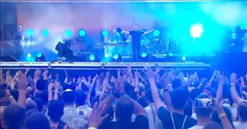 <p>This is a powerful moment of worship caught on film. In this clip, Michael W. Smith leads over 50,000 people in worship with &ldquo;Awesome God.&rdquo;</p>

<p>This 90&rsquo;s worship song is a timeless classic in glorifying the Lord. In the midst of war in Ukraine, Michael W. Smith went to a nearby city of Budapest, Hungary to encourage the people there.&nbsp;</p>

<p>He tells the crowd that Yahweh is in the place with them and invites them to sing along. We see thousands of joyful worshipers smiling and celebrating the mightiness of the Lord. With their hands lifted and clapping along, the many people honor Jesus together.&nbsp;</p>

<p>The audience sounds incredible with their voices. Michael lifts his microphone stand so that the crowd&rsquo;s voices all come through the speakers. It is a powerful moment of unity in numbers. Michael heads to the piano, and the band is worshiping their hearts out at their instruments.&nbsp;</p>

<p>The stadium is full of people. It is incredible. As the camera zooms in on specific faces, you can&rsquo;t help but wonder where they are from and what their stories are as you see them cry out to the Lord. This song is so powerful and motivating as we watch hundreds upon hundreds of people sing along and give glory to God.&nbsp;</p>

<p>At the end of the song, Michael hits high notes as the band continues to hit notes together, and he revs up the crowd.</p>

<p>This exhilarating moment of praise invites us even online to join in. It is a great reminder to us that our God is reigning over every nation around the entire world.</p>

<p><em>&ldquo;Be still, and know that I am God. I will be exalted among the nations, I will be exalted in the earth!&rdquo; <a href="https://www.godtube.com/bible/Psalms/46-10">Psalm 46:10</a></em></p>
