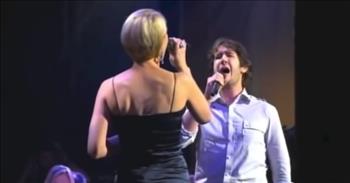 <p>Watch this wonderful performance from Josh Groban and Jen Malenke singing a duet of 'Bridge Over Troubled Water.'</p>

<p>&ldquo;When you're weary, feeling small, when tears are in your eyes, I will dry them all<br />
I'm on your side, oh, when times get rough and friends just can't be found<br />
Like a bridge over troubled water, I will lay me down<br />
Like a bridge over troubled water, I will lay me down&rdquo;</p>

<p>This is such a beautiful song, and these two knocked it out of the park with their performance! Josh Groban and Jen Malenke both have incredible voices, and the two of them sound amazing together.</p>

<p>&ldquo;Such a classic song by Simon and Garfunkel, and Jen and Josh did it justice,&rdquo; <a href="https://www.youtube.com/watch?v=lca0wYLFmtg">comments</a> one person on YouTube after watching the video. &ldquo;This song will never grow old.&rdquo;</p>

<p>&ldquo;Amazing performance, such beautiful harmony between them both. I was mesmerized by Jen's voice, definitely one of my favorite renditions of this song,&rdquo; <a href="https://www.youtube.com/watch?v=lca0wYLFmtg">writes</a> another person online.</p>

<p>'Bridge Over Troubled Water' was written by Paul Simon after he was inspired by an old gospel song. The song was released in 1970, and it was the second single on Simon &amp; Garfunkel&rsquo;s fifth album also titled Bridge Over Troubled Water.</p>

<p>The song topped the charts and picked up five Grammy awards in 1971, including Song of the Year and Record of the Year. 'Bridge Over Troubled Water' became Simon &amp; Garfunkel&rsquo;s biggest hit and their signature song.</p>

<p>It is a beautiful song with a lovely meaning behind it. The line &ldquo;Like a bridge over troubled water&rdquo; is a metaphor for someone living through a trying time in their life. And &ldquo;I will lay me down&rdquo; references the sacrifices and perseverance as they find a way through difficulty.</p>

<p>We hope that you enjoyed listening to this rendition of 'Bridge Over Troubled Water' from Josh Groban and Jen Malenke today!</p>
