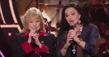 <p>Crystal Gayle and Peggy Sue Wright, belt out the words to "Coal Miner's Daughter" at the CMT Artists of the Year 2022 in honor of their late sister.&nbsp;</p>

<p>On October 4, 2022 country music icon Loretta Lynn died at the age of 90. After decades in the spotlight, Loretta truly left a lasting legacy that will continue to live on.&nbsp;</p>

<p>&ldquo;Well, I was borned a coal miner's daughter<br />
In a cabin, on a hill in Butcher Holler<br />
We were poor but we had love<br />
That's the one thing that daddy made sure of<br />
He shoveled coal to make a poor man's dollar&rdquo;</p>

<p>Loretta Lynn has been called the queen of country music. Her iconic songs have truly stood the test of time and they still resonate with fans today.</p>

<p>Over the years, Loretta wrote every single song that she recorded. Writing was actually more important to her than singing and the fans responded in waves.</p>

<p>She has been called a &lsquo;trailblazer&rsquo; and a &lsquo;powerful voice for women.&rsquo; Her unique style and heartfelt lyrics paved the way for other female voices, so it&rsquo;s only fitting that her own sisters are singing her most famous single.</p>

<p>One viewer on YouTube wrote, &ldquo;You can hear the pain in their voices. Loretta was a true legendary icon she was a great gift to watch over the years. Crystal and Peggy you did your sister proud.&rdquo;</p>

<p>Another said, &ldquo;This will always be Lorettas song but these two just bought a whole new level of depth to this it's almost as if it's a sweet lullaby being sung to their sister.&nbsp; The low tones and rifts just gives the chills.&rdquo;</p>

<p>What an incredible way to honor this unforgettable woman.</p>
