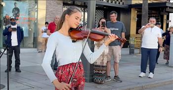 <p>Let your mind drift away as this teen violinist performs the beloved Elvis Presley song &lsquo;Can&rsquo;t Help Falling In Love.&rsquo;</p>

<p>This iconic tune was originally recorded in 1961 for Elvis&rsquo; hit film &lsquo;Blue Hawaii.&rsquo; It skyrocketed to the top of the charts and spurred countless covers from artists all around the world.</p>

<p>&ldquo;Wise men say only fools rush in<br />
But I can't help falling in love with you<br />
Oh, shall I stay, would it be a sin<br />
Oh, if I can't help falling in love with you?&rdquo;</p>

<p>Today, Karolina Protsenko and her mother are putting their own spin on this iconic tune while entertaining passersby on the street. You may recognize Karolina from one of her many viral violin performances.</p>

<p>For years, she has shared her musical talents with the world through incredible covers such as &lsquo;Hallelujah&rsquo; and &lsquo;Unchained Melody.&rsquo; Karolina is truly a talented teen and the Internet seems to agree. With over 10 million views across social media, Karolina is making a name for herself as an artist on the rise.</p>

<p>Today, Karolina is performing one of her most popular songs with this beautiful rendition of &lsquo;Can&rsquo;t Help Falling In Love.&rsquo;</p>

<p>&ldquo;Like a river flows, surely to the sea<br />
Darling, so it goes, some things are meant to be<br />
Take my hand, take my whole life too<br />
Oh, for I can't help falling in love with you&rdquo;</p>

<p>This song always transports me to another time and place and it was just the perfect dose of nostalgia. Who else agrees?</p>
