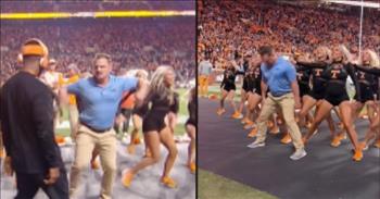 <p>Check out how the University of Tennessee football fans react when a security guard interrupts the cheerleading routine and everyone goes wild. It might not be what you&rsquo;d expect!</p>

<p>For those that don&rsquo;t understand football, the cheerleaders and the marching bands are sometimes the most entertaining parts of the game. Yes, I said it!&nbsp;</p>

<p>So, getting in the way of their dazzling costumes and fancy moves, whether acrobatic or musical, might get a person in trouble. And that&rsquo;s exactly what it looked like would happen for a security guard during a <a href="https://en.wikipedia.org/wiki/Tennessee_Volunteers#:~:text=The%20Tennessee%20Volunteers%20and%20Lady%20Volunteers%20are%20the,as%20a%20member%20of%20the%20Southeastern%20Conference%20%28SEC%29.">Tennessee Volunteers</a> football game.</p>

<p>Watch as the dude in the blue shirt, and khaki pants backs up, seemingly oblivious, into one of the cheerleaders during a dance routine. She runs over to a coach to ask for help; the security guard is ruining their routine! With his headset in place, the sideline coach intervenes on the young woman&rsquo;s behalf. Apparently, there is a break in the action on the field, and the coach can attend to other business.&nbsp;&nbsp;&nbsp;&nbsp;&nbsp;&nbsp;</p>

<p>The coach runs over to the clueless security guard, and an argument ensues. The security guard turns toward the field and is then pushed back toward the sideline by the dancers. But he doesn&rsquo;t make it off the field. Instead, he joins in the dance!</p>

<p>He&rsquo;s not in a leotard or stretchy pants, but this guy has got the moves! And he&rsquo;s not actually a security guard, either.&nbsp;</p>

<p>He&rsquo;s Michael Galyean, an aspiring actor, and dancer. Michael was approached by Women&rsquo;s Cheer and Dance Coach <a href="https://utsports.com/staff-directory/kelley-tafazzoli/3987">Kelley Tafazzoli </a>to participate in the spoof during the October 29 game. Michael received a video of the dance only one week prior to the performance, and he had only one hour to rehearse with the team!&nbsp;</p>

<p>Michael has the timing, the attitude, and the dance skills that are called for. He is a natural among the ladies! In fact, if his acting goals don&rsquo;t pan out, he may have a place on the squad!</p>

<p><em>&ldquo;Therefore encourage one another and build each other up, just as in fact, you are doing.&rdquo; <a href="https://www.godtube.com/bible/1-thessalonians/5-11">1 Thessalonians 5:11</a></em></p>
