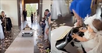 Flower Girl Drives Down The Aisle In Style