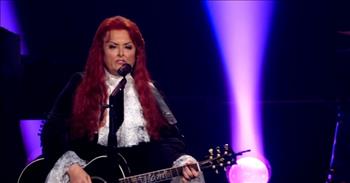 <p>Wynonna Judd, a member of one of the most iconic, beloved country music groups of all time, turned in a stirring performance of one of her hit songs.&nbsp;</p>

<p>Music is a terrific outlet for people to channel their thoughts and feelings. Those who are cheerful, optimistic or have recently fallen in love can sing about it. Music also gives those people who are hurting or struggling with the loss of a loved one the ability to express their grief through sound and lyrics.&nbsp;</p>

<p>In a <a href="https://www.youtube.com/watch?v=D6WnkTWXtwE">clip posted to YouTube</a>, Wynonna Judd takes the stage and gives a heartfelt and moving performance of the Judds&rsquo; classic &ldquo;Grandpa.&rdquo; It&rsquo;s a beautiful performance from a singer who recently suffered a great loss.&nbsp;</p>

<p>The popular song from the 1980s is of a grandchild asking their grandfather about the good old days. The child asks grandpa question after question, seeking answers for why things are the way they are in the world today. The child simply wants to go back to the good old days.</p>

<p>&ldquo;Did families really bow their heads to pray?<br />
Did daddies really never go away?<br />
Whoa, whoa, grandpa, tell me &lsquo;bout the good old days&rdquo;</p>

<p>In the clip, Wynonna stands on stage, singing to the adoring crowd all alone. Throughout the heartbreaking performance, Wynonna exudes strength and resiliency to be able to get through that song without breaking down in tears. Last year, Noami, Wynonna&rsquo;s mother and bandmate, took her own life.&nbsp;</p>

<p>About halfway through the clip, near the 2:45-minute mark, the crowd joins her in singing the song&rsquo;s memorable, but heartbreaking chorus.&nbsp;</p>

<p>At the end of the clip, the crowd erupts in a round of thunderous applause, giving their warm approval to Wynonna&rsquo;s terrific performance.&nbsp;</p>

<p><em><a href="https://www.godtube.com/bible/revelation/21-4">Revelation 21:4 </a>&ldquo;He will wipe away from them every tear from their eyes. Death will be no more; neither will there be mourning, nor crying nor pain, anymore. The first things have passed away.&rdquo;</em></p>

