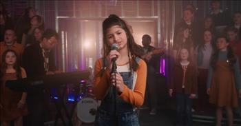 <p>Dozens of musically gifted children turned in an impressive performance of a hit song by The Pretenders.</p>

<p>Hard times will visit everyone at one time or another. Going through life without experiencing at least some adversity, tragic or devastating circumstances is a near impossibility. However, having a steadfast, trustworthy friend or significant other by your side as it is happening can make all the difference in the world.&nbsp;</p>

<p>In a <a href="https://www.youtube.com/watch?v=VwpuBxetheI">video posted on YouTube</a>, the One Voice Children&rsquo;s Choir performs a song, originally from The Pretenders, about sticking by someone through thick and thin. &ldquo;I&rsquo;ll Stand by You&rdquo; is about never deserting someone in their time of need and always being a comforting, calming presence during life&rsquo;s storms and uncertainties.&nbsp;</p>

<p>In the video, dozens of children stand on risers singing and moving along to the song as gentlemen on the guitar, keyboard, drums and bass play. Additionally, throughout the 4-minute video, several children step up to microphones and belt out the lyrics.&nbsp;</p>

<p>The children&rsquo;s rendition is a more upbeat and up-tempo version of the 1994 hit from The Pretenders. These children have all obviously been blessed with a ton of musical talent, which they all put on full display.&nbsp;</p>

<p>On the About section of their YouTube channel, One Voice Children&rsquo;s Choir, a nonprofit, states the organization&rsquo;s &ldquo;mission is to inspire the world through the power of children&rsquo;s voices.&nbsp;</p>

<p>In the video description for &ldquo;I&rsquo;ll Stand by You,&rdquo; the organization mentions they identify with the lyrics in the Pretenders' hit.</p>

<p>&ldquo;In a world that often feels divided, we resonate with this anthem of unity and support. Together we can stand strong, united and unstoppable.&rdquo;</p>

<p>What a beautiful guiding message and lovely performance from all involved.</p>

<p><em><a href="https://www.godtube.com/bible/isaiah/41-10">Isaiah 41:10</a> &ldquo;Have no fear, for I am with you; do not be looking about in trouble, for I am your God; I will give you strength, yes, I will be your helper; yes, my true right hand will be your support.&rdquo;</em></p>
