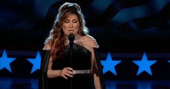 <p>Remember our fallen heroes as you watch <a href="https://jodeemessina.com/bio/">Jo Dee Messina</a> sing &ldquo;Heaven Was Needing a Hero.&rdquo;&nbsp;</p>

<p>Ms. Messina performed the beautiful tribute during a National Memorial Day Concert held in Washington, D.C. The annual concert has become a tradition, <a href="https://en.wikipedia.org/wiki/National_Memorial_Day_Concert">first taking place over 30 years ago</a> in 1989. <a href="https://www.digitaltrends.com/movies/national-memorial-day-concert-where-to-watch/">Aired on PBS</a>, instead of streaming channels that require subscriptions, this year&rsquo;s event featured a variety of musical guests, actors, and others, including Trace Adkins, Megan Hilty, Joe Mantegna, Mary McCormack, Gary Sinise, and more.</p>

<p>Jo Dee sings the song she first released on her 2010 album, Unmistakable Inspiration. She wrote the ballad after the death of the <a href="https://www.countrythangdaily.com/heaven-hero-soldier-jo-dee/">first female American soldier in the Iraqi War</a>, and &ldquo;If Heaven Was Needing A Hero&rdquo; has been played in honor of many soldiers lost in battle since that time.&nbsp;&nbsp;&nbsp;</p>

<p>Dressed in black and silver, Ms. Messina is elegant, respectful, and somber as she pays tribute to America&rsquo;s military heroes. And, while she sings, film clips and photographs tell the stories of loss and grief, service and sacrifice.&nbsp;</p>

<p>At 1:15, the first set of scenes begins. We see caskets being loaded into hearses, cemetery stones with birthdates of those too young to have been lost, children and wives in anguish, and American flags folded and passed to surviving parents or draped over a hero&rsquo;s final resting place. The video shows individuals in the audience. Many are teary-eyed, moved by her lyrics, and too familiar with the feelings they convey.&nbsp;</p>

<p>At 3:03, the second set of images fills the screen. This time, there are videos and photos of soldiers from past generations. Survivors pay tribute on battlefields and beaches, and veterans who have grown old weep for their brothers taken so many years ago. One kisses a war memorial; another runs an aged hand over a wall of names. The bonds these soldiers have formed are unlike any others.&nbsp;</p>

<p>You may have noticed a tattoo on the inside of Jo Dee&rsquo;s right arm. While it&rsquo;s hard to be certain, it looks like it is a scripture reference&mdash;Psalms 3:16 written with a perpendicular line that forms a cross. Ms. Messina has dealt with trials of her own, most notably a cancer diagnosis in 2017 and the treatment that followed. She shared that it was a front porch visit from Jesus Christ that saved her.&nbsp;&nbsp;&nbsp;&nbsp;</p>

<p>Heartache and pain will find every one of us, but it sure is a blessing when we have found Him first!</p>

<p><em>&ldquo;These are the last words of David: &ldquo;The inspired utterance of David son of Jesse, the utterance of the man exalted by the Most High, the man anointed by the God of Jacob, the hero of Israel&rsquo;s songs:&rdquo; <a href="https://www.godtube.com/bible/2-samuel/23-1">2 Samuel 23:1</a></em></p>
