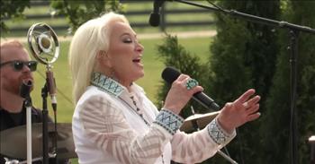 <p>Check out country legend Tanya Tucker perform the song &lsquo;Delta Dawn&rsquo; in this CMT Summer Session music video.</p>

<p>&ldquo;Delta Dawn, what's that flower you have on, could it be a faded rose from days gone by?<br />
And did I hear you say he was a-meeting you here today to take you to his mansion in the sky?<br />
She's 41 and her daddy still calls her "baby," all the folks 'round Brownsville say she's crazy<br />
'Cause she walks downtown with suitcase in hand, looking for a mysterious dark-haired man&rdquo;</p>

<p>Tanya Tucker does a great job performing her signature song at this intimate concert in front of a picturesque lake with her band. And the audience is clearly having a great time watching her perform!</p>

<p>The song &lsquo;Delta Dawn&rsquo; was composed by songwriters Alex Harvey and Larry Collins, and the words to the song were reportedly inspired by Alex Harvey&rsquo;s mother. The song has been covered by a number of artists, but the most notable ones were Bette Midler, Helen Reddy, and Tanya Tucker. In fact, all three singers recorded and released their renditions of &lsquo;Delta Dawn&rsquo; all within months of each other.</p>

<p>And even though all of the recordings did well, none had the staying power like Tanya Tucker&rsquo;s version. She released her rendition of &lsquo;Delta Dawn&rsquo; in April 1972, when she was just 13 years old! It was her debut single off her album of the same name. The song even helped her score her first Grammy nomination in the category of Best Female Country Vocal Performance. &lsquo;Delta Dawn&rsquo; turned out to be the song that would take Tanya Tucker to country stardom.</p>

<p>&ldquo;Definitely still her song!&rdquo; <a href="https://www.youtube.com/watch?v=yNdpSD6rmtk">comments</a> one person on YouTube after watching the video. &ldquo;Brings up so many memories. Tanya still has a beautiful voice.&rdquo;</p>

<p>We hope that you enjoyed this video of Tanya Tucker performing the song &lsquo;Delta Dawn&rsquo; today!</p>
