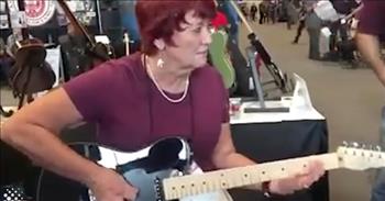 <p>A woman in her early 60s showed off her stunning musical skills while performing a series of riffs on an electric guitar.</p>

<p>Most people want to use their life to accomplish things, to make something of themselves. However, that&rsquo;s much easier said than done. In life, it&rsquo;s hard to accomplish nearly anything of value without discipline, determination and thousands of hours of focused, intense practice.&nbsp;</p>

<p>A <a href="https://www.youtube.com/watch?v=sbIsfZOk7CM">clip posted on YouTube </a>shows 61-year-old Paul Jo Taylor playing the guitar. It&rsquo;s clear from the get-go that this grandmother of four has skills. The way in which her nimble fingers move up and down the guitar with ease is the product of hours and hours of practice.&nbsp;</p>

<p>Due to the many instruments laid out and displayed on the table behind her, it appears she is possibly at a music/instrument-type convention. The clip likely shows Paula trying out one of the vendors&rsquo; guitars.&nbsp;</p>

<p>At one point, very early in the clip, as she strums along the guitar, she seems to indicate that she&rsquo;s pleased with the guitar. Paula looks up at the camera and gives her approval of the instrument.</p>

<p>&ldquo;Very nice, very nice,&rdquo; Paula says.</p>

<p>At the end of her short, impromptu performance, Paula receives a warm reception. There is a smattering of applause and cheering for this rocking grandmother.&nbsp;</p>

<p>This woman truly does rock! In fact, according to the video&rsquo;s description, she is a part of the rock duo the Taylors. Her daughter, Amanda, makes up the other part of the group.&nbsp;</p>

<p>This 61-year-old grandmother of four, with her remarkable talent on the guitar, would be most people who would pick up a guitar to shame. She is outstanding!&nbsp;</p>

<p>Paula proves that age really is just a number and does not have much of a bearing on our skills or abilities. If you have the drive and determination, most goals are achievable.&nbsp;</p>

<p><em><a href="https://www.godtube.com/bible/james/1-17">James 1:17</a> &ldquo;Every good gift and every perfect gift is from above, and comes down from the Father of lights, with whom is no fickleness, neither shadow of turning.&rdquo;</em></p>

