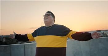 <p>Words like joy, happiness, and love come to mind when watching the new &ldquo;This Is Jesus&rdquo; official music video by Jordan Smith. And, well, those are among three of the best adjectives there are to define and describe our Savior!</p>

<p><a href="https://www.jubileecast.com/articles/29730/20230806/check-out-jordan-smiths-new-song-this-is-jesus.htm">Recorded in the streets of Dallas, Texas</a>, the video features approximately a dozen individuals of different races, ethnicities, ages, and backgrounds as they sing, dance, and praise in a variety of cityscapes.&nbsp;</p>

<p>While often, God&rsquo;s creation is on display in Christian music videos&mdash;snow-capped mountains, gorgeous golden wheat fields, shimmering and sunlit waterfalls&mdash;Jordan&rsquo;s video puts God&rsquo;s children against muraled city walls, on busy streets and under concrete overpasses. But these folks aren&rsquo;t hurried or frustrated; they are rejoicing!</p>

<p>&ldquo;This is Jesus&rdquo; is a celebratory song! The lyrics refer to a few of Jesus&rsquo;s everyday actions, like healing the blind, offering freedom from our chains, and giving peace in our pain. These are dance-worthy deeds, and Jordan and crew know that!</p>

<p>The chorus goes as follows:</p>

<p>Lift your eyes, raise your voice to the King of all creation&nbsp;<br />
He is love, He is life; This is Jesus&nbsp;<br />
Gather every nation like a billion streams of light&nbsp;<br />
&lsquo;Til every heart, every soul can feel Him reach us&nbsp;</p>

<p>The song was written by McKay Crockett, Tyler Castleton, and Staci Peters. McKay says of the video, &ldquo;I love how the song and music video personifies the universality of Jesus. He is for every person, from every walk of life.&rdquo;</p>

<p><a href="https://screenrant.com/the-voice-jordan-smith-car-accident-albums-married/">Jordan Smith was just 22 years old</a> in 2015 when he competed on <em>The Voice</em>. All four judges turned their chairs for Jordan, but he joined Adam Levine&rsquo;s team and won the entire season!&nbsp;</p>

<p>Jordan&rsquo;s been busy since then recording and writing music, and he&rsquo;ll be on <a href="https://thisisjesus.live/">tour</a> soon, visiting other big cities with other big-name artists, including Michael W. Smith, Steven Curtis Chapman, and Jordin Sparks. We&rsquo;re betting those will be joy, happiness, and love-filled shows!</p>

<p><em>&ldquo;Whoever does not love does not know God, because God is love.&rdquo; <a href="https://www.godtube.com/bible/1-john/4-8">1 John 4:8</a></em></p>
