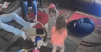 <p>This video is from a security camera that captures an epic catch from a pint-sized toddler girl.&nbsp;</p>

<p>When we think of the phrase &ldquo;play ball,&rdquo; we think of nostalgic moments of America's beloved pastime of baseball. With legends like <a href="https://en.wikipedia.org/wiki/Yogi_Berra">Yogi Berra</a>. But he&rsquo;s got nothing on this little Nebraskan girl. She might be slated for the big leagues. Or maybe it was just pure luck. Either way, the moment is amazing.&nbsp;</p>

<p>It&rsquo;s a typical afternoon in the small town of Alliance, Nebraska, where mom and dad are taking a breather on the couch after attempting to keep their two little girls entertained. Mom seems to be waiting for Dad to get off the phone as she mindlessly plays with a strand of her hair.&nbsp;</p>

<p>The girls are corralled in the living room when their oldest daughter kicks a pink ball up into the air. At that exact moment, the little sister in her footie pajamas rubs the hair on her head when the ball lands directly into her palms. It&rsquo;s quite the catch because Dad is shocked and tries to get his wife&rsquo;s attention. He couldn&rsquo;t believe what he just saw. His jaw drops open, and he is absolutely stunned.&nbsp;</p>

<p>The older sister giggles and grabs the ball from little sister, and continues to kick it around the living as if nothing major happened. After all, she&rsquo;s the bigger sister, if anything cool happens, it&rsquo;s because she&rsquo;s the one doing it.&nbsp;</p>

<p>I bet Dad is thankful for this unexpected moment. He was probably thinking his dad days would be filled with pink toys, ballet, and dance. But both of his little girls seem to be into sports. His oldest can kick and the youngest can catch. Who knows, maybe soccer or softball is in his future. This dad is incredibly blessed to have two active, playful, and happy little girls. We hope you enjoyed this rare and unexpected catch of the day!&nbsp;</p>
