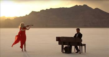 <p>Beauty and inspiration abound is this angelic piano cover of &ldquo;Agnus Dei,&rdquo; arranged and performed by JOSLIN.</p>

<p>&ldquo;Angus Dei&rdquo; is Latin and <a href="https://www.britannica.com/topic/Agnus-Dei-liturgical-chant">translates</a> in English to &ldquo;Lamb of God.&rdquo; While this performance is an instrumental one, little imagination is required to hear with utter clarity the words of the chorus in your mind. The majesty of the setting, the heavenly sunrises and sunsets captured in the video, and the glorious music shared communicate with absolute certainty that our God is holy and worthy!</p>

<p>Here are <a href="https://genius.com/Michael-w-smith-agnus-dei-live-lyrics">three lines from the chorus</a> of the &ldquo;Angus Dei,&rdquo; written and composed by <a href="https://en.wikipedia.org/wiki/Michael_W._Smith">Michael W. Smith</a>:&nbsp;&nbsp;</p>

<p>Holy, holy<br />
Are You Lord God, Almighty<br />
Worthy is the Lamb, worthy is the Lamb&nbsp;&nbsp;</p>

<p>Violinist <a href="https://www.emilyburak.com/about-2">Emily Burak</a> joins <a href="https://www.joslinmusic.com/bio">Joslin</a> in this recording. The two began their musical journeys at the ages of 3 and 4, respectively. Her filmy red dress and blonde hair blow with the winds that whip across the <a href="https://www.visitutah.com/places-to-go/parks-outdoors/bonneville-salt-flats">Bonneville Salt Flats</a>, but she plays seemingly unphased.&nbsp;</p>

<p>Joslin begins playing at 10 seconds, and his fingers dance across the keys&mdash;evidence of God&rsquo;s gift and years of hard work. They are doing what they are destined to do!</p>

<p>The two play in a location that may be unfamiliar to you; it was to me. It looks like packed snow, but, in fact, it is packed salt. The salt field, with mountains in the distance in most directions, covers about 46 square miles in western Utah. The vastness of the space makes it difficult to discern east from west and morning sunrise from evening&rsquo;s setting sun.&nbsp;&nbsp;&nbsp;</p>

<p>The <a href="https://www.acousticsciences.com/asc-articles/the-wall-in-the-desert/">openness of the desert</a> environment doesn&rsquo;t offer an echo, but Emily&rsquo;s violin does. She answers JOSLIN&rsquo;s piano for about 30 seconds beginning at 2:35. Amidst their exquisite playing, we see snapshots of God&rsquo;s handiwork. JOSLIN and Emily are huge talents, and their performance is grand. But, like all of us, they are small against His creation!&nbsp;</p>

<p>He is indeed almighty!&nbsp;&nbsp;&nbsp;&nbsp;</p>

<p><em>&ldquo;The next day John saw Jesus coming toward him and said, &ldquo;Look, the Lamb of God, who takes away the sin of the world!&rdquo; <a href="https://www.godtube.com/bible/john/1-29">John 1:29&nbsp;</a></em></p>
