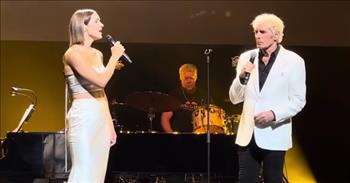 <p>Listen to this mesmerizing performance by Katherine McPhee and Michael Bolton when they sing &lsquo;The Prayer&rsquo; as a duet with her husband David Foster on the piano.&nbsp;</p>

<p>Can you imagine two well-known voices coming together to sing a song written about selfless love? Katharine had planned to sing alone when David invited Michael to stay and sing with his wife. In case you didn&rsquo;t know, David actually wrote the song, &lsquo;The Prayer&rsquo; for Celine Dion and Andrea Bocelli to sing together.&nbsp;</p>

<p>I love the moment when Michael agreed and commented in a serious but teasing fashion that &lsquo;The Prayer&rsquo; is one of the best-written songs of all time. Katharine came on stage in an elegant silver evening gown. She was poised and full of grace as she looked lovingly at her husband before she stood by Michael. As the rich piano tunes filled the air, the first lyrics of the song elegantly wafted into the air too.</p>

<p>&ldquo;I pray you'll be our eyes, and watch us where we go<br />
And help us to be wise, in times when we don't know<br />
Let this be our prayer when we lose our way<br />
Lead us to a place, guide us with your grace, to a place where we'll be safe&rdquo;</p>

<p>What a stunning impromptu performance between these two. Michael, with his years of being a vocalist, harmonizes perfectly with Katharine&rsquo;s ethereal voice creating a beautiful melody.&nbsp;</p>

<p>As the song came to an end, they hit the high notes in unison and carried the last note together. Katharine smiled and grabbed Michael&rsquo;s hand to lead him off stage as David asked the crowd to give both Katharine and Michael a round of applause. It was well deserved.&nbsp;</p>

<p>What a lovely, rich performance. May this song bless you and warm your heart. And we hope that you enjoyed watching this video and listening to &lsquo;The Prayer&rsquo; performed by Katharine McPhee, Michael Bolton, accompanied by David Foster.</p>

<p><em><a href="https://www.godtube.com/bible/1-john/5">1 John 5:14-15&nbsp;</a><br />
&ldquo;And this is the confidence that we have toward him, that if we ask anything according to his will he hears us. And if we know that he hears us in whatever we ask, we know that we have the requests that we have asked of him.&rdquo;</em></p>
