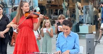 <p>A talented 8-year-old girl who can play the violin and carry a tune joined violinist Karolina Protsenko and her mother for a lovely performance of Celine Dion&rsquo;s classic, &ldquo;My Heart Will Go On.&rdquo;</p>

<p>Speaking and performing in public is a major fear for most of the population. Having all those people watching and silently judging your every move is admittedly a frightening scenario. Sadly, it&rsquo;s enough to keep a lot of people from ever pursuing a passion or a dream.</p>

<p>However, one young woman, Emily Minko, at just 8 years old, seems to have conquered that fear. <a href="https://www.youtube.com/watch?v=xWoyMPMD2oQ">In a clip posted on YouTube</a>, the little lady performed with Karolina on the side of a busy street in front of a sizable crowd as others watched while passing by.&nbsp;</p>

<p>But instead of playing it safe and going with a song many aren&rsquo;t familiar with, they went with &ldquo;My Heart Will Go On.&rdquo; Of course, it&rsquo;s Celine Dion&rsquo;s hit tune from one of the biggest movies of all time &ndash; &ldquo;Titanic.&rdquo;</p>

<p>The song begins with Emily strumming along on her violin as Karolina&rsquo;s mother tickles the ivories on a keyboard. After a few seconds of Emily playing solo, Karolina joins in, playing the lovely and memorable classic track.&nbsp;</p>

<p>Then, at approximately the 2-minute mark in the clip, the violin-playing youngster steps up to the microphone and shows off her vocal skills, singing solo. She sounds a bit nervous and perhaps even a little unsure of herself. However, the young woman does a fantastic job and does not miss or flub a single lyric.&nbsp;</p>

<p>Karolina&rsquo;s mother also shows off her musical talent. Not only does she play the keyboard, but she also beautifully belts out the words of the Celine Dion tune.&nbsp;</p>

<p>Those who gathered to take in the delightful performance thoroughly enjoyed and appreciated the trio&rsquo;s inspired display. At the song&rsquo;s conclusion, they give the three women a much-deserved round of applause.</p>

<p><em><a href="https://www.godtube.com/bible/psalms/104-33">Psalm 104:33</a> &ldquo;I will make songs to the Lord all my life; I will make melody to my God while I have my being.&rdquo;</em></p>
