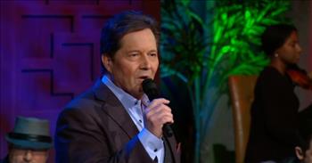 <p>Savor this bit of nostalgia as Ronnie Booth performs the iconic Glen Campbell hit, &ldquo;Rhinestone Cowboy,&rdquo; at Gaither Studios in Alexandria, Indiana. It&rsquo;s a delight!</p>

<p>Ronnie Booth is not Glen Campbell, but he does look a little like Dale Midkiff from the <a href="https://en.wikipedia.org/wiki/Love_Comes_Softly"><em>Love Comes Softly</em></a> series. And he does a right fair job of singing the classic Campbell tune!&nbsp;</p>

<p>However, even the writer of &ldquo;Rhinestone Cowboy&rdquo; didn&rsquo;t do it like Mr. Campbell. Larry Weiss wrote and recorded the song in 1974, but it didn&rsquo;t have much success in the United States; it did reach #71 in Australia in August of that year.</p>

<p>Evidently, Glen Campbell heard the song while touring in Australia, learned it, and was eager to accept when Capitol Records approached him about recording &ldquo;<a href="https://en.wikipedia.org/wiki/Rhinestone_Cowboy">a great new song</a>.&rdquo; Music industry insiders noted that Mr. Campbell identified with the song&rsquo;s subject matter right away.&nbsp;</p>

<p>The idea of surviving hard times and persevering when the chips are down really resonated with the artist. <a href="https://en.wikipedia.org/wiki/Rhinestone_Cowboy">Stephen Thomas Erlewine of AllMusic</a>&nbsp; described the song as one about a veteran artist "who's aware that he's more than paid his dues during his career ... but is still surviving, and someday, he'll shine just like a rhinestone cowboy.&rdquo;&nbsp;&nbsp;</p>

<p>Here are a few lines from &ldquo;<a href="https://genius.com/Glen-campbell-rhinestone-cowboy-lyrics">Rhinestone Cowboy</a>:&rdquo;</p>

<p>I've been walkin' these streets so long<br />
Singin' the same old song<br />
I know every crack in these dirty sidewalks of Broadway<br />
Where hustle's the name of the game</p>

<p>When Glen Campbell&rsquo;s version of &ldquo;Rhinestone Cowboy&rdquo; was released in May, 1975, it became an instant hit. It seems he was the best person to sing the catchy classic, but it&rsquo;s sure nice that Mr. Booth performs it so well here. Ronnie&rsquo;s rich tones, combined with the drum beats, electric guitar, piano, and strings, bring us right back there! Definitely a fun blast from the past!</p>

<p><a href="https://en.wikipedia.org/wiki/Glen_Campbell">Glen Campbell died in 2017</a> at the age of 81. He was laid to rest at the Campbell family cemetery in Billstown, Arkansas, but it&rsquo;s not hard to imagine him blinged out and singing this and so many others in some beautiful arena far north of here!</p>

<p><em>We can rejoice, too, when we run into problems and trials, for we know that they help us develop endurance. <a href="https://www.godtube.com/bible/romans/5-3">Romans 5:3</a></em></p>
