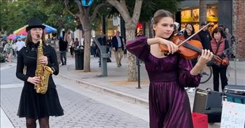 <p>Check out this inspirational performance by two young artists downtown. A violinist performs a dazzling cover of 'Careless Whisper.'</p>

<p>Karolina Protsenko is known worldwide for her incredible skill set of performing violin while dancing. She has been in countless viral videos and interviewed on national platforms. In this video, Karolina has partnered with Avelina Kushnir, who can play the saxophone like none other. These two young ladies are just around 15 years old. They are influencing the arts even from such youthful ages.&nbsp;</p>

<p>At the start of the video Avelina begins playing the melody line of &ldquo;Careless Whisper&rdquo; with such confidence. A crowd gathers around to hear them play. Suddenly, Karolina comes in with a violin solo. The girls have sass and style as they play in harmony with one another. People all around pull out their phones to record.&nbsp;</p>

<p>One small boy pulls out an instrument, trying to imitate them. These young women bring something awe-inspiring into an everyday setting of shopping. It is absolutely incredible to witness. People of all ages and backgrounds stand together while enjoying the song. At one point, there are two little sisters who drop some money in their hat.&nbsp;</p>

<p>Then, the adorable preschool boy walks up with his instrument with joy. The girls dance around while hitting every note.&nbsp;</p>

<p>As the girls finish their performance, the crowd cheers and they take a bow and then hug one another. It is a sweet bond of sisterhood. There is something very special about watching people be unified. It reminds our hearts of what God originally designed.&nbsp;</p>

<p>The way that these two have worked together and give each other time to shine encourages us. We see a visual of true friendship and teamwork.&nbsp;</p>

<p><em>&ldquo;How good and pleasant it is when God&rsquo;s people live together in unity!&rdquo; <a href="https://www.godtube.com/bible/Psalms/133-1">Psalm 133:1</a></em></p>
