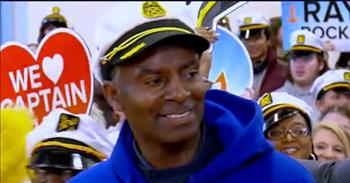 <p>&ldquo;Captain&rdquo; Ray Bethea has worked at Community High School in Swannanoa, North Carolina for over a decade and is in for a big surprise!&nbsp;</p>

<p>Good Morning America came to the school to honor him. Ike Ejiochi, one of the GMA hosts opened the door to a meeting Ray was attending. He pulls him out of the meeting and Ike talks to Ray, <a href="https://www.youtube.com/watch?v=zDcA7yaSgug">saying</a>, &ldquo;Everyone says that you help make this building feel so much more than a school.&rdquo; He then walks Ray into the gym where many people are standing and holding signs of love.</p>

<p>Ike comments that here in the gym are students, colleagues, and even his wife. All there to let him know how much they love and appreciate him.&nbsp;</p>

<p>The video goes on to talk about how Ray is a &ldquo;Ray of Sunshine&rdquo; to the high school and the people he sees each day. They started calling him &ldquo;Captain Ray&rdquo; after he bought a captain&rsquo;s hat and started wearing it every day.</p>

<p>The video then shows different students and other adults who have been touched by Ray&rsquo;s kindness. Lyric, a student, <a href="https://www.youtube.com/watch?v=zDcA7yaSgug">says</a> &ldquo;If you&rsquo;re feeling down and need somebody to talk to, Mr. Ray is definitely the person to go to.&rdquo; The video goes on to share how Mr. Ray helps students and faculty alike, from helping a new young girl who had just lost her father, to a teacher who needed a little extra support.&nbsp;</p>

<p>Mr. Ray is truly there for the students and faculty. We go back to the gym where the principal gives some words of kindness about him. Ike then asks an important question about where his spirit and energy come from.</p>

<p>Ray <a href="https://www.youtube.com/watch?v=zDcA7yaSgug">responds</a>, &ldquo;Well I just have to give God the glory because again that&rsquo;s where it started for me.&rdquo; Ray tears up a bit and the crowd cheers for him again. Then, GMA lets Ray know that they are sending him and his wife to Las Vegas to see Lionel Richie with a two-night stay at Cesar&rsquo;s Palace.</p>

<p>From the whole video you can tell how much Ray is appreciated and giving the glory to God makes this story one of the best. Ray is truly showing the spirit of God to those around them and everyone is better for it.&nbsp;</p>

<p><em>&ldquo;I have glorified you on the earth: I have finished the work which you gave me to do.&rdquo; - <a href="https://www.godtube.com/bible/john/17-4">John 17:4</a></em></p>
