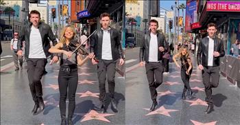 <p>This is an amazing work of art and creativity. Check on Lindsey Stirling and Gardiner Brothers' dazzling performance on the Hollywood Walk of Fame.&nbsp;</p>

<p>Lindsey is an incredible violinist, dancer, and performer. She stands up front confidently in her edgy all-black outfit. She and the boys are standing on the Hollywood stars in LA. Behind her, the Gardiner Brothers begin Irish step dancing with Lindsey as she plays the violin. They switch positions as she goes to the back, and they are in unison with their steps and routine. It is mesmerizing and a group of high-level talent.</p>

<p>As they film this routine, a crowd of pedestrians gather to join in by viewing the fun. The trio combines hip hop, classical, and tap in a blend of modern dance meets classical music. It is stunning to see the inventive mindset of this group to draw a young audience to a more traditional instrument.&nbsp;</p>

<p>You do not hear violin on most top hit songs, but Lindsey is taking the social media world by storm. She is always growing in popularity and exposing the next generation to timeless classical pieces in a culturally exciting way. She is brilliant. The elements of entertainment, precision, and pure happiness are shown in this clip. Their performance leads us to want to see even more.&nbsp;</p>

<p>The Bible might be an older book, but the message is always perfect and active in every generation. God has spoken clearly to us. Just like Lindsey has learned to bring the message of her music in a creative way to the culture, may we be reminded to share our faith and the gospel in new ways while standing on eternal truth to reach the world around us.</p>

<p><em>&ldquo;But the plans of the Lord stand firm forever, the purposes of his heart through all generations.&rdquo; <a href="https://www.godtube.com/bible/Psalms/33-11">Psalm 33:11</a></em></p>
