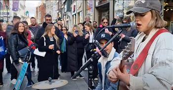 <p>What a compelling performance by popular street performer and YouTube personality Allie Sherlock!&nbsp;</p>

<p>Allie is known for her amazing covers of popular songs performed on the street in Dublin and shared worldwide on YouTube. Allie is only 18 years old but has a powerful singing voice and can engage the audience watching her on the street.</p>

<p>This particular song, &lsquo;Proud Mary,&rsquo; is upbeat and catchy. It has become quite a popular song; most people recognize it when they hear it.&nbsp;</p>

<p>&lsquo;Proud Mary&rsquo; <a href="https://en.wikipedia.org/wiki/Proud_Mary">is a song</a> by the band Creedence Clearwater Revival and was first released as a single in January of 1969. Ike and Tina Turner then released their own version in 1971, for which they won a Grammy in 1972.&nbsp;</p>

<p>Guitarist John Fogerty wrote the song in just two days after being discharged from the National Guard.&nbsp;</p>

<p>There is no doubt that the crowd watching Allie is enjoying her music. They are standing around watching intently, smiling, and taking photos and videos. She really can stop traffic with her musical abilities.</p>

<p>&ldquo;Big wheel keep on turnin'</p>

<p>Ooh, the Proud Mary keep on burnin'</p>

<p>And we're rollin' (rollin'), rollin', yeah (rollin')</p>

<p>Rollin' on the river (rollin' on the river)&rdquo;&nbsp;</p>

<p>The chorus to &lsquo;Proud Mary&rsquo; gets in your head, and you can&rsquo;t help but want to sing it out loud. During Allie&rsquo;s performance, she engages the crowd to sing with her. &ldquo;I want everybody to help me out. It&rsquo;s really easy, just one word&hellip;rollin&rsquo;,&rdquo; <a href="https://www.youtube.com/watch?v=wZiEn5pqn6c">she tells everyone watching</a>. She starts to sing, and the crowd does their part, responding with &ldquo;rollin&rsquo;.&rdquo;&nbsp;</p>

<p>Allie not only sings the song but also plays the guitar at the same time. She is focused and animated, which makes for such a beautiful performance of the popular song.&nbsp;</p>

<p><em>&ldquo;Sing to him, sing psalms to him: talk you of all his wondrous works.&rdquo; - <a href="https://www.godtube.com/bible/psalms/105-2"><strong>Psalms 105:2</strong></a>&nbsp;</em></p>
