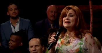 <p>Singer Joy Gardner turned in a beautiful performance of the hymn &ldquo;Holy Ground&rdquo; in a lyric video.</p>

<p>None of us could ever do anything to obtain forgiveness and earn salvation. If that were the case, there would be no hope for anyone, and all would be condemned to live out their days in their sin and shame. Eternal life would not be possible, so a disastrous fate would await all after their time on Earth expired.</p>

<p>But God made a way, sending His one and only Son to Earth. Jesus Christ willingly went to the cross, bleeding and then enduring a horrible and agonizing death. Days later, Christ would arise, roll the stone away and walk out of the grave.&nbsp;</p>

<p>He went through all of that for our sake. He bled and died so that we might have forgiveness and experience eternal life with Him. Forgiveness, love and hope are gifts freely offered to all. All one must do is confess with their mouth and believe in their hearts that Jesus Christ is Lord.</p>

<p>What a wonderful, magnificent and holy God!&nbsp;</p>

<p>In a <a href="https://www.youtube.com/watch?v=8w0NucFPZos">clip posted on YouTube</a>, Joy sings about God's awe-inspiring and holy nature. It&rsquo;s a beautiful and moving performance of a wonderfully written tune, with lyrics celebrating and praising God and His son, Jesus Christ.</p>

<p>The song's chorus is beautiful.</p>

<p>&ldquo;We are standing on holy ground</p>

<p>And I know that there are angels all around</p>

<p>Let us praise Jesus now</p>

<p>We are standing in His presence on holy ground&rdquo;</p>

<p>In addition to singing about God&rsquo;s awesome and mighty love, the lyrics state that if there is a need in your life, reach out for Him and it will be met.</p>

<p>Joy is not the only person who displays their musical talents in the video. At various points in the nearly five-minute video, the audience joins in on the performance, standing up and lending their voices to the lovely song.&nbsp;</p>

<p><em><strong><a href="https://www.godtube.com/bible/acts/7-33">Acts 7:33</a></strong> &ldquo;And the Lord said, &lsquo;Take off the shoes from your feet, for the place where you are is holy.&rdquo;</em></p>
