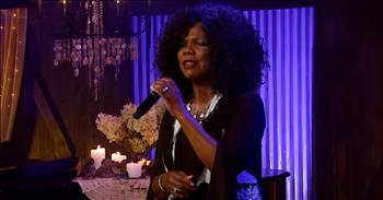 <p>Listen to this moving performance by Lynda Randle of the song &lsquo;Sheltered In The Arms Of God.&rsquo; These lyrics remind us of the protection we find in our Lord!</p>

<p>&ldquo;I feel the touch of hands so kind and tender,&nbsp;</p>

<p>They're leading me in paths that I must try&nbsp;&nbsp;</p>

<p>I'll have no fear, for Jesus walks beside me,&nbsp;</p>

<p>For I'm sheltered in the arms of God&rdquo;</p>

<p>This beautiful song was originally written by Dottie Rambo, and Lynda Randle does a wonderful job covering it! Many people online shared their thoughts about this lovely rendition.</p>

<p>&ldquo;Dottie Rambo&rsquo;s songs are lyrically beautiful, threaded with the difficult experiences of her life. &nbsp; She was an amazing lady who loved an amazing God. Beautiful rendition, Lynda,&rdquo; <a href="https://www.youtube.com/watch?v=cJCPlMYECtM">comments</a> one person on YouTube after watching the video.</p>

<p>&ldquo;Beautiful song, beautiful rendition! Lynda Randle has such a beautiful deep velvet voice, and she expresses the emotion so well, that we can feel the message right into the depth of our souls and hearts!&rdquo; <a href="https://www.youtube.com/watch?v=cJCPlMYECtM">writes</a> another person online.</p>

<p>As for the story behind the song, Dottie has shared how the song came to be.</p>

<p>"There had been a very bad storm the day before, and driftwood was scattered along the beach. I was going through a time that was a low valley for me. It was sort of a 'storm' in my own life,&rdquo; Dottie <a href="https://www.staugustine.com/story/lifestyle/faith/2016/02/26/story-behind-song-sheltered-arms-god/16316471007/">shared</a>. &ldquo;As the whitecaps broke across the water, and as I walked among the driftwood and the seaweed with my guitar strapped over my shoulder, I pondered the lyrics of several songs that the Lord seemed to be giving to me at the time."</p>

<p>She <a href="https://www.staugustine.com/story/lifestyle/faith/2016/02/26/story-behind-song-sheltered-arms-god/16316471007/">continued</a>: "All of a sudden I thought, 'Lord, this storm is so much like my life, and yet, in the midst of the storms of life, you have been a shelter to me. When I can't take the storm, I run to you for that shelter and, suddenly, I feel secure. While thinking on those things and watching as the wind kicked up the waters, I began to write a song.&rdquo;</p>

<p>We hope that the song &lsquo;Sheltered In The Arms Of God&rsquo; was an encouragement for you today!</p>
