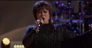 <p>Check out this moving cover of the song &lsquo;I&rsquo;ll Stand By You&rsquo; from Olivia Rubini on <em>The Voice</em>.</p>

<p>&ldquo;Oh, why you look so sad?</p>

<p>Tears are in your eyes</p>

<p>Come on and come to me now</p>

<p>Don't be ashamed to cry&rdquo;</p>

<p>This performance by Olivia Rubini is from <em>The Voice</em> Playoffs, and she did an amazing job! The judges on <em>The Voice</em> were enthralled by her performance, as was the audience. Her voice draws you in, and she is just lovely to listen to. Many people online thought the same!</p>

<p>&ldquo;Perfect song choice for her. So good!&rdquo; <a href="https://www.youtube.com/watch?v=PNZ-NGnKqDU">comments</a> one person on YouTube after watching the video.</p>

<p>&ldquo;There's something so special about her. I want to hear more,&rdquo; <a href="https://www.youtube.com/watch?v=PNZ-NGnKqDU">writes</a> another person online.</p>

<p>Being the daughter of a music producer and drummer, music has always been an important part of Olivia Rubini&rsquo;s life. She started releasing music at the age of 15, and her musical style throughout the years has evolved and transformed to reflect her life and growth. Even though she went to college and explored international relations and political science, music remained her priority. In 2021, Olivia released her first album titled Silhouettes, with her dad being her producer.</p>

<p>Olivia has a dynamic pop voice, and some of her inspirations include Fleetwood Mac, Coldplay, The Rolling Stones, Harry Styles, and Miley Cyrus. When Olivia Rubini auditioned for Season 25 of The Voice, her talent impressed the judges and captivated the audience. And this performance of &lsquo;I&rsquo;ll Stand By You&rsquo; was no different! Olivia put her own spin on this popular song, and it was so entertaining to see her do her thing up on that stage!</p>

<p>We hope that you enjoyed watching this video of Olivia Rubini singing &lsquo;I&rsquo;ll Stand By You&rsquo; today! We can&rsquo;t wait to see what comes from this talented singer next!</p>
