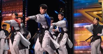 <p>Taekwondo Group Mesmerizes With Golden Buzzer Routine On Britain&#39;s Got Talent</p>

<p>You have to watch this taekwondo group mesmerize the judges and audience on Britain&rsquo;s Got Talent and walk away with a Golden Buzzer routine!</p>

<p>The taekwondo group is called Ssaulabi Performance Troupe, and at the beginning of their performance, all the members huddle together and yell out a group chant. They are bringing the energy right from the start!&nbsp;</p>

<p>One of the first tricks of the performance is one of the troupe members chopping through 9 concrete slabs with her hand! So impressive! The next trick includes one guy doing a giant backflip and kicking through multiple boards on his way down. What a crazy sight to see! Later, another guy does a running jump while flipping sideways in the air and kicks a board in half. Trick after trick, the routine just continues to get more impressive as time goes on.</p>

<p>&ldquo;Flying wood everywhere!&rdquo; says one of the hosts as another trick is happening on stage. The hosts then proceed to put on safety glasses in a comical bit.</p>

<p>The judges are in awe and are screaming and cheering on the group as they watch their performance unfold on stage. When Ssaulabi Performance Troupe concludes their act, the hosts come running from the side of the stage to press the golden buzzer for the group!</p>

<p>&ldquo;The power, the beauty, the artistry! It blows everything else I&rsquo;ve seen out of the water!&rdquo; says judge Bruno Tonioli.</p>

<p>&ldquo;My goodness, I need more of that!&rdquo; judge Alesha Dixon says. &ldquo;I can&rsquo;t even imagine how much discipline, hard work, and dedication it&rsquo;s taken for you to achieve what you just did there today. It was exciting! You&rsquo;ve got us screaming! Genuinely, that might be one of the best things I&rsquo;ve seen on this show.&rdquo;</p>

<p>Britain&rsquo;s Got Talent stage has never seen an act like this before, and we can&rsquo;t wait to see what this taekwondo group does next at the live shows!</p>

