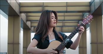 <p>A young woman nails a guitar cover of Michael Jackson&rsquo;s &lsquo;Beat It,&rsquo; and you don&rsquo;t want to miss a single note! Josephine, a young guitar virtuoso from Jakarta, Indonesia, has taken the <a href="https://www.youtube.com/channel/UCyLATKbctfN_N6uq0IHvfZg">internet</a> by storm with her stunning fingerstyle cover of Michael Jackson's iconic hit, 'Beat It.' Standing on a rooftop on a cloudy day dressed in black, Josephine played her heart out, showcasing her incredible talent and passion for music.</p>

<p>Fingerstyle guitar, a <a href="https://en.wikipedia.org/wiki/Fingerstyle_guitar#:~:text=Fingerstyle%20guitar%20is%20the%20technique,called%20a%20%22pick%22).">technique</a> involving plucking the strings directly with fingertips, fingernails, or finger picks, allows for intricate and expressive performances. Josephine's rendition of 'Beat It' is a testament to the beauty and complexity of this technique. Each note and chord was meticulously articulated, creating a rich and dynamic soundscape that captivated listeners worldwide.</p>

<p>With 2.28 million <a href="https://www.youtube.com/channel/UCyLATKbctfN_N6uq0IHvfZg">subscribers</a> on YouTube, Josephine has built a substantial following, drawn to her exceptional skill and heartfelt performances. Her 'Beat It' cover quickly went viral, amassing over 115,143 <a href="https://www.youtube.com/watch?v=1lyDsly8sMg&amp;ab_channel=JosephineAlexandra">views</a> and counting. Fans from around the globe have been praising her ability to breathe new life into a classic song while maintaining the essence of Michael Jackson's original masterpiece.</p>

<p>Josephine&rsquo;s love for music is evident in every performance, and her dedication to her craft continues to inspire aspiring musicians everywhere. Her viral success is a reminder of the universal language of music and its power to connect people across cultures and backgrounds.</p>

<p>In moments like these, we can truly appreciate the gift of music. As Josephine's fingers dance across the guitar strings, we are reminded of the words from Psalms: "Sing to him a new song; play skillfully, and shout for joy." &mdash; <a href="https://www.godtube.com/bible/psalms/33-3">Psalm 33:3</a>. Her skill and joy in playing resonate deeply, reflecting the beauty and joy that music brings to our lives.</p>

<p>Thank God for the gift of music and for talents like Josephine, who share their passion and bring joy to others. May she continue to inspire and touch hearts with her extraordinary talent.</p>

<p><em><strong><a href="https://www.godtube.com/bible/psalms/33-3">Psalm 33:3</a></strong> "Sing to him a new song; play skillfully, and shout for joy."&nbsp;</em></p>
