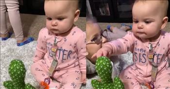 <p>In a video that has melted hearts across the internet, an adorable baby girl dressed in pink footie pajamas had the sweetest chat with her favorite new toy, Spike the Cactus. Barely able to sit up on her own, this precious little one was utterly captivated by the animated cactus that moves, lights up, and, most charmingly, repeats her babble.</p>

<p>The video, endearingly <a href="https://www.youtube.com/watch?v=i5jOf2O7Fqs&amp;ab_channel=ViralHog">captioned</a>, &ldquo;I bought Spike the Cactus for my one-year-old daughter&rsquo;s birthday. She absolutely loves this toy and loves talking to it and dancing to its songs,&rdquo; showcases a heartwarming interaction that is sure to bring a smile to anyone's face.</p>

<p>As the baby girl cooed and grunted, Spike mirrored her sounds, creating an enchanting back-and-forth that seemed to delight her to no end. Her face lit up with pure joy each time Spike repeated one of her adorable babbles, making it clear that she had found a new best friend in this quirky toy. The cactus, with its bright lights and catchy tunes, was the perfect companion for this tiny tot&rsquo;s lively chatter and spontaneous dance moves.</p>

<p>Viewers were quick to comment on the video, with many expressing how the baby&rsquo;s innocent delight and Spike's playful responses brightened their day. One viewer <a href="https://www.youtube.com/watch?v=i5jOf2O7Fqs&amp;ab_channel=ViralHog">wrote</a>, "This is the cutest one I&rsquo;ve seen yet. Who gets the last word in? Right?&rdquo; <a href="https://www.youtube.com/watch?v=i5jOf2O7Fqs&amp;ab_channel=ViralHog">while </a>another noted, "Beautiful baby girl is not putting up with the cactus back talk."</p>

<p>This sweet video reminds us of the simple joys in life and the magic of a child&rsquo;s laughter. It&rsquo;s a scene that captures the innocence and wonder of childhood, where even a talking cactus can become a beloved friend. Watching this baby girl&rsquo;s heartwarming chat with Spike, it&rsquo;s easy to see why such moments are treasured and shared, spreading smiles and warmth to all who see them.</p>

<p><em><strong><a href="https://www.godtube.com/bible/proverbs/16-24">Proverbs 16:24</a></strong> "Gracious words are a honeycomb, sweet to the soul and healing to the bones."</em></p>
