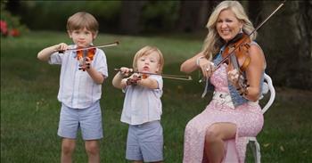 <p>Check out this adorable musical performance. A family delivers a lovely cover of &lsquo;You Are My Sunshine.&rsquo;&nbsp;</p>

<p>At the start of the video, we see a family on a backcountry road with a violin and keyboard. The group is called Rosemary Siemens and Family. There are multiple generations side by side making this lovely rendition. Rosemary begins to sing. Her father harmonizes with her. Then, her son jumps in, singing with them. Three generations are singing together. It is beautiful.&nbsp;</p>

<p>In the next verse, the grandfather sings about imagining he was holding his daughter in his arms. After that, the grandson sings a precious solo to the chorus. The camera zooms in on his sweet face, and he sings so adorably on pitch. The men lead the next chorus, and the women harmonize. This family is singing in the most beautiful setting. The mother is then seen in a violin instrumental solo with her two sons. The boys love playing their tiny violins alongside their talented mom.</p>

<p>She finishes the final verse with a solo. All of them begin to sing together. It is a timeless song that reminds us of parents who have sung it to us and children we have sung the classic lullaby to in the past. It is emotional and heartwarming to watch and listen to this family. It reminds us of the value and beauty of the generations. God has blessed us with the gift of multiple generations loving and learning from one another. We can show Him gratitude for our own families as we view this video. Seeing a family use their musical abilities together inspires us and reminds us of the beautiful teamwork our families can have together. He has a blessing in the design of a family established on Him and His Word. He is faithful.&nbsp;</p>

<p><em>&ldquo;I will keep My covenant between Me and you, and your offspring after you throughout their generations, as an everlasting covenant to be your God and the [God] of your offspring after you.&rdquo; <strong><a href="https://www.godtube.com/bible/Genesis/17-7">Genesis 17:7</a></strong></em></p>
