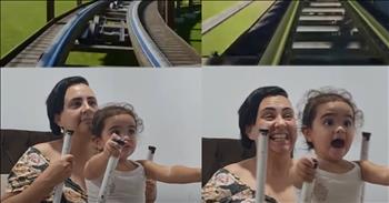 <p>A sweet video captures a child's adorable reaction to a roller coaster ride.</p>

<p>Arguably, one of the best things about the warmer temperatures and the summer months is visiting amusement parks. Every year, typically beginning in early to late May, amusement parks around the country reopen for those eager to get back on thrill rides. The temperature and the humidity increase, and crowds inevitably flock to amusement parks.&nbsp;</p>

<p>Of course, the big draw at most of those parks is the roller coasters. Most people enjoy the adrenaline rush that comes with the frightening heights and the lightning-fast speeds commonly associated with those thrill rides. However, as much fun as roller coasters are, they are not for everyone. That's why nearly every park has weight and height requirements for rides.</p>

<p>For that reason, one mother likely recreated a roller coaster ride for her toddler in a sweet and hilarious video. <a href="https://www.youtube.com/shorts/i3tSb7_KUR0">The short clip perfectly</a> captures the child's reaction while enjoying a "ride" on one of those massive, quick-moving coasters.</p>

<p>In the video, the mother ingeniously plays a POV (point of view) video while having her child sit on her lap. The two watch the video together as the mother moves the child accordingly, perfectly in sync with the video they are watching.&nbsp;</p>

<p>While many people would not be too impressed with this kind of roller coaster "ride," the child is having the time of her life. The toddler watches the clip and reacts to the movements with absolute pure delight and maybe even a slight bit of terror. The child's face is so expressive, and the virtual ride gives the little one much enjoyment.&nbsp;</p>

<p>The child is currently way too young and small to be able to ride a roller coaster currently. However, given how much the toddler loved the virtual ride, it's clear to see that the little one will likely become a roller coaster enthusiast in the future.</p>

<p><em><strong><a href="https://www.godtube.com/bible/proverbs/22-6">Proverbs 22:6</a></strong> "If a child is trained up in the right way, even when he is old he will not be turned away from it."</em></p>
