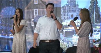 <p>Inside the cozy, dimly lit hall of the Bible Camp, a trio of young adults delivered a stunning performance of the classic hymn &lsquo;The Old Rugged Cross,&rsquo; leaving the audience in awed silence. The stage was set against a backdrop of soft, ambient lighting, casting a serene glow over the performers and adding to the intimate atmosphere of the evening.</p>

<p>As the trio, two beautiful ladies and one young man, stepped onto the stage, their presence immediately commanded attention. Each of them brought a unique voice to the performance, their harmonies blending to create a powerful and tender sound. From the moment they began, it was evident that their rendition of this timeless hymn was something truly special.</p>

<p>The trio transformed the hymn, renowned for its deep spiritual resonance and beautiful melody, into a moving experience. Their voices, rich with emotion and sincerity, captured the very essence of the song's message. Every note and lyric was delivered with such grace and intensity that it felt as though the air was filled with the spirit of the hymn.</p>

<p>Initially silent and contemplative, the audience was completely absorbed in the performance. The quiet of the room was palpable, a declaration of the profound impact the trio&rsquo;s music was having. Faces in the crowd were lit up with expressions of awe, and the stillness of the room was a powerful reflection of how deeply the music was touching everyone present.</p>

<p>As the final notes of &lsquo;The Old Rugged Cross&rsquo; lingered in the air, a sense of reverence swept over the hall. The trio's performance had not just been a display of musical talent but a moving tribute to the hymn&rsquo;s enduring legacy. The audience remained silent for a moment longer, savoring the profound beauty of the experience before erupting into heartfelt applause.</p>

<p>This remarkable performance by the trio poignantly reminded us of the transformative power of music and the deep connections it can forge. Their ability to evoke such strong emotions and create such a memorable experience was nothing short of extraordinary, leaving an indelible mark on everyone fortunate enough to witness it.</p>

<p>We hope you enjoyed this beautiful rendition of &lsquo;The Old Rugged Cross&rsquo; as much as we did! The trio&rsquo;s heartfelt performance truly captured the spirit of the hymn and touched everyone in the audience.</p>

<p><em><strong><a href="https://www.godtube.com/bible/psalms/100-1">Psalm 100:1-2</a></strong> "Shout for joy to the Lord, all the earth. Worship the Lord with gladness; come before him with joyful songs."</em></p>
