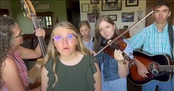 <p>Check out this stunning performance. Family delights with a lovely bluegrass cover of &lsquo;In The Sweet By And By.&rsquo;</p>

<p>The Campbell family starts out strong on their instruments. Each family member has a voice or an instrument. The mother holds the rhythm on the bass. Each child has their own unique gift. A precious young girl with glasses sings the verses as her mother and older sister join in on the choruses. They have beautiful voices.</p>

<p>This family has unity in their music making and are easy listening. It is delightful to watch this sweet group play from the comfort of their home. You see the closeness of this family when thinking about how much they have had to practice this together and the adorable memories hanging behind them on the home wall photo display.&nbsp;&nbsp;</p>

<p>This classic hymn shares in the chorus:</p>

<p>&lsquo;In the sweet by and by,</p>

<p>We shall meet on that beautiful shore.&rsquo;</p>

<p>The harmonies are creative, and the family ends the song with such flair and fun. You see a few of the group members show a smile after their performance. Seeing a family come together to worship the Lord is very motivating. It reminds us of our enjoyment when we worship the Lord in song with others, especially our loved ones.&nbsp;</p>

<p>As we ponder the joys that await all believers of Jesus in heaven, may this song stir our affection for Christ. May it lead us to reflect on His goodness and the peaceful and perfect life that awaits us. We have His Spirit with us now, and although we do not see His face yet, we have Him in our hearts and can celebrate His nearness to us each day.</p>

<p><em>&ldquo;I will be glad and rejoice in you; I will sing the praises of your name, O Most High&rdquo;. <strong><a href="https://www.godtube.com/bible/Psalms/9-2">Psalm 9:2</a></strong></em></p>
