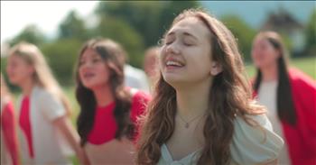<p>A massive children's choir turned in a stunning cover performance of the hit "You Say" by Christian music artist Lauren Daigle.</p>

<p>There likely isn't a more prominent name in Christian music than Lauren Daigle. Everything from the talented young woman quickly becomes a hit, making its way to the top of the charts. In everything she does, her talent and the message of God's love, faithfulness and forgiveness always shine through.</p>

<p>In her short career, Lauren has already experienced a lot of success. Many of her tunes have become hits, including "You Say." That song is arguably her biggest song. Soon after it was released, it achieved crossover success and was played extensively on pop radio stations. That song has also spawned hundreds of covers, including one from the One Voice Children's Choir.</p>

<p><a href="https://www.youtube.com/watch?v=EPw_0FWk8CI">In the video posted on YouTube</a>, the talented young people use their God-given musical talents to give an incredible and chilling version of "You Say." The children's vocal talents shine, giving anyone who listens to this cover a most enjoyable experience. It's a cover that you'll likely return to repeatedly.</p>

<p>Not only is the cover well performed by all who appear in the video, but the clip is beautifully shot. The young performers are seen singing in lush, breathtaking landscapes, perfectly capturing God's stunning creation.</p>

<p>As good as the young people's performance is, Lauren's original lyrics make this song such a beloved classic. It's a tune that tells of God's love and that even when we're at our weakest and feel alone and worthless, we still matter to Him, the Creator of the universe.</p>

<p>"You say I am loved when I can't feel a thing</p>

<p>You say I am strong when I think I am weak</p>

<p>And You say I am held when I am falling short</p>

<p>And when I don't belong, oh, You say I am Yours"</p>

<p>What powerful words!</p>

<p><em><strong><a href="https://www.godtube.com/bible/colossians/3-16">Colossians 3:16</a></strong> "Let the word of Christ dwell in you richly in all wisdom; teaching and admonishing one another in psalms and hymns and spiritual songs, singing with grace in your hearts to the Lord."</em></p>
