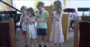 <p>Watch this precious worship video as these four kids deliver an adorable version of &lsquo;Jesus Loves The Little Children.&rsquo;&nbsp;</p>

<p>At the start of the video, two boys and two girls are each handed a microphone as they stand in front of a church service. They smile nervously, and some even look at their shoes as if making eye contact with the church audience might make them shy. The piano accompanies the kids, and they begin to sing the well-known song, &lsquo;Jesus Loves The Little Children.&rsquo; Their voices are quiet, filled with shyness and innocence. As they start the chorus, one of the older girls smiles and even chews on the microphone a bit.&nbsp;</p>

<p>&lsquo;Jesus loves the little children,</p>

<p>All the children of the world.</p>

<p>Red and yellow, black and white,</p>

<p>All are precious in His sight,</p>

<p>Jesus loves the little children of the world.&rsquo;</p>

<p>At the end of the performance, as the song's final notes faded, all four kids exchanged shy smiles, setting their microphones down in unison like hot potatoes. They ran off the stage without hesitation, happy that the spotlight was no longer on them. You could see the weight of nerves lift as they eagerly headed back to what most likely excited them&mdash;playing with toys and attending Sunday School.</p>

<p>It was absolutely precious to witness the innocence and joy in these children as they sang about Jesus&rsquo; love. Their performance wasn&rsquo;t perfect, but that&rsquo;s exactly what made it so touching. There&rsquo;s something incredibly special about watching kids learn about the love of Jesus in such a pure and simple way. This touching song reminds us of an important truth: it doesn&rsquo;t matter if we&rsquo;re five, 50, or 105&mdash;we are all God&rsquo;s beloved children.</p>

<p><em><strong><a href="https://www.godtube.com/bible/matthew/19-14">Matthew 19:14</a></strong> "Let the little children come to me, and do not hinder them, for the kingdom of heaven belongs to such as these."</em></p>
