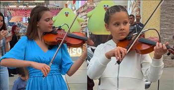 <p>Check out this extremely precious video of young people performing together in a public shopping center. Young violinists mesmerize with a stunning &lsquo;A Thousand Years&rsquo; duet.&nbsp;</p>

<p>As this performance begins, we see seasoned teenager Karolina Protsenko alongside the young Emily Minko. Emily is only 8-years-old. Karolina tells Emily that she has not played this song in a while, and when she begins to play, Emily says, &ldquo;Yes,&rdquo; in response to confirm that was the song she wanted her to play. The little girl asks if she can play with Karolina. She goes to get her violin from her mother. The two of them then have their violins in hand, ready to go. The duo begin their performance. The crowds gather around from all ages at the outdoor shopping center.&nbsp;</p>

<p>Emily begins and does a phenomenal job. Karolina starts to play harmonies with Emily and accompanies her beautifully. Suddenly, in the second verse, a little boy brings up a small tambourine and plays alongside the girls. Karolina dances and plays. At the next chorus, an even younger boy joins in with his guitar. It is a precious moment seeing all of these sweet young children performing with Karolina. She is encouraging the next generation to embrace music and passing along the torch of a love for music just like she was given by those who mentored and invested in her life.&nbsp;</p>

<p>Watching this video reminds us of the importance of sharing Christ with the next generation so that they can know about the hope that we have in Him. We welcome the young people around us and encourage them in their lives to have genuine relationships with God and live life for His glory.</p>

<p><em>&ldquo;We will not hide them from their children, telling to the generation to come the praises of the Lord, And His strength and His wonderful works that He has done.&rdquo; <strong><a href="https://www.godtube.com/bible/Psalm/78-4">Psalm 78:4</a></strong></em></p>
