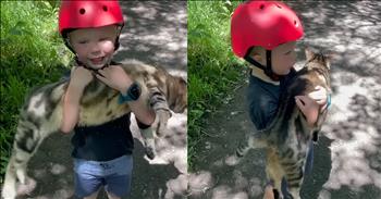 <p>A child has the sweetest interaction with a cat he found. Family outings often lead to unexpected adventures, but nothing prepared Thomas&rsquo; mom for the hilarity that ensued on a recent bike ride. As Thomas&rsquo; family pedaled along a bike path, Thomas came to a screeching halt when he was certain he had found a lost cat.&nbsp;</p>

<p>With excitement, and still wearing his bicycle helmet, he carried the cat to his mom declaring the poor thing needed a home and to be taken care of. What makes it so hilarious is just how big the cat is and Thomas&rsquo; little arms. Mom could clearly see the annoyed expression on the cat&rsquo;s well fed face on top of the light pink collar around its neck. Clearly, it wasn&rsquo;t a stray. More likely, it was a neighborhood cat enjoying its morning stroll.&nbsp;</p>

<p>Still, Thomas was determined to be the hero of the day. The video gets even funnier thanks to the conversation between Thomas and his mother as she tries to gently convince him to let the cat go. But Thomas, ever the problem solver, has other ideas.&nbsp;</p>

<p>&ldquo;Let&rsquo;s put him down in the water,&rdquo; Thomas says as he turns around to head up the bike trail. No, not in the water, not in the water. Thomas put that cat down gently,&rdquo; his mother said. In Thomas&rsquo; mind, putting the cat into a nearby stream seemed like a perfectly good idea, but his mom had to swiftly step in and save the cat from an unwanted bath. Meanwhile, the cat waited patiently, draped over Thomas&rsquo; little arms.&nbsp;</p>

<p>Finally Thomas sets him down on the side of the bath and mom can breathe a sigh of relief. The video of this charming moment was captured by Thomas&rsquo; mom has now gone viral with over 300,00 likes. No doubt, most viewers were probably laughing over the sweet exchange. Thomas&rsquo; heart was in the right place and gave everyone a reason to smile, especially when he suggested putting the cat into the water.&nbsp;</p>

<p>In the end, moments like this remind us how much adventure a child can find on a simple bike ride on an ordinary day. Who knows, maybe that well-fed cat will cross paths with Thomas again, though hopefully not near any water!&nbsp;</p>

<p><em><strong><a href="https://www.godtube.com/bible/proverbs/12-10">Proverbs 12:10</a></strong> "The righteous care for the needs of their animals, but the kindest acts of the wicked are cruel."</em></p>
