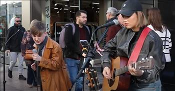 <p>There&rsquo;s something undeniably magical about the way music can stop us in our tracks. It has the power to captivate, inspire, create fun moments, and even bring strangers together. You&rsquo;ll love street performers Allie Sherlock and Rhys McPhilips as this duo performs a fantastic cover of Elvis Presley&rsquo;s classic of &lsquo;Jailhouse Rock.&rsquo;&nbsp;</p>

<p>Dressed down in a leather jacket, jeans, and a black baseball cap, Allie focuses on the words as she lifts her guitar and strums for the first few opening lines of the famous song. But then she belts out the first few lyrics, stopping shoppers in their tracks. She sings with immense passion and has a deep, throaty voice that reminds me of Kelly Clarkson and Lauren Daigle. She is a soulful vocal powerhouse with flair and style. Before we know it, it&rsquo;s Rhys&rsquo; turn to join in.&nbsp;</p>

<p>&lsquo;Let's rock</p>

<p>Everybody, let's rock</p>

<p>Everybody in the whole cell block</p>

<p>Was dancin' to the Jailhouse Rock&rsquo;</p>

<p>Rhys managed to capture what made Elvis Presley so legendary. He sang with a unique combination of power and raw emotion, perfectly capturing the song's attitude. Together, Allie and Rhys created a vibrant and energetic song, and they blended their voices seamlessly.&nbsp;</p>

<p>The crazy thing about this pair singing is they are mere teenagers. Teens who have a passion for music and a love for performing. It makes one wonder where they will be in a few years, as we hope they will get the opportunity to realize their dreams with a record deal. Their voices are the kind you won&rsquo;t soon forget. As they finished the last few notes of the song, the crowd erupted into applause while Allie and Phys smiled and thanked everyone for listening. We hope you enjoyed this performance just as they enjoyed performing a classic.&nbsp;</p>

<p><em><strong><a href="https://www.godtube.com/bible/psalms/96">Psalm 96:1-3</a></strong> "Sing to the Lord a new song; sing to the Lord, all the earth. Sing unto the LORD, bless his name; shew forth his salvation from day to day. Declare his glory among the heathen, his wonders among all people.</em></p>

